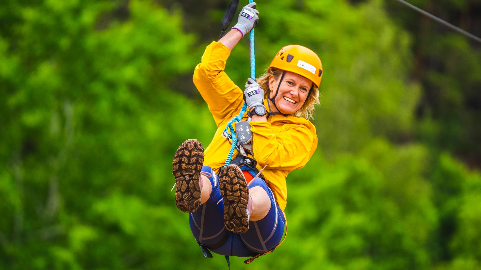 Woman in a zip line at Via Ferrata Haldenkanalen