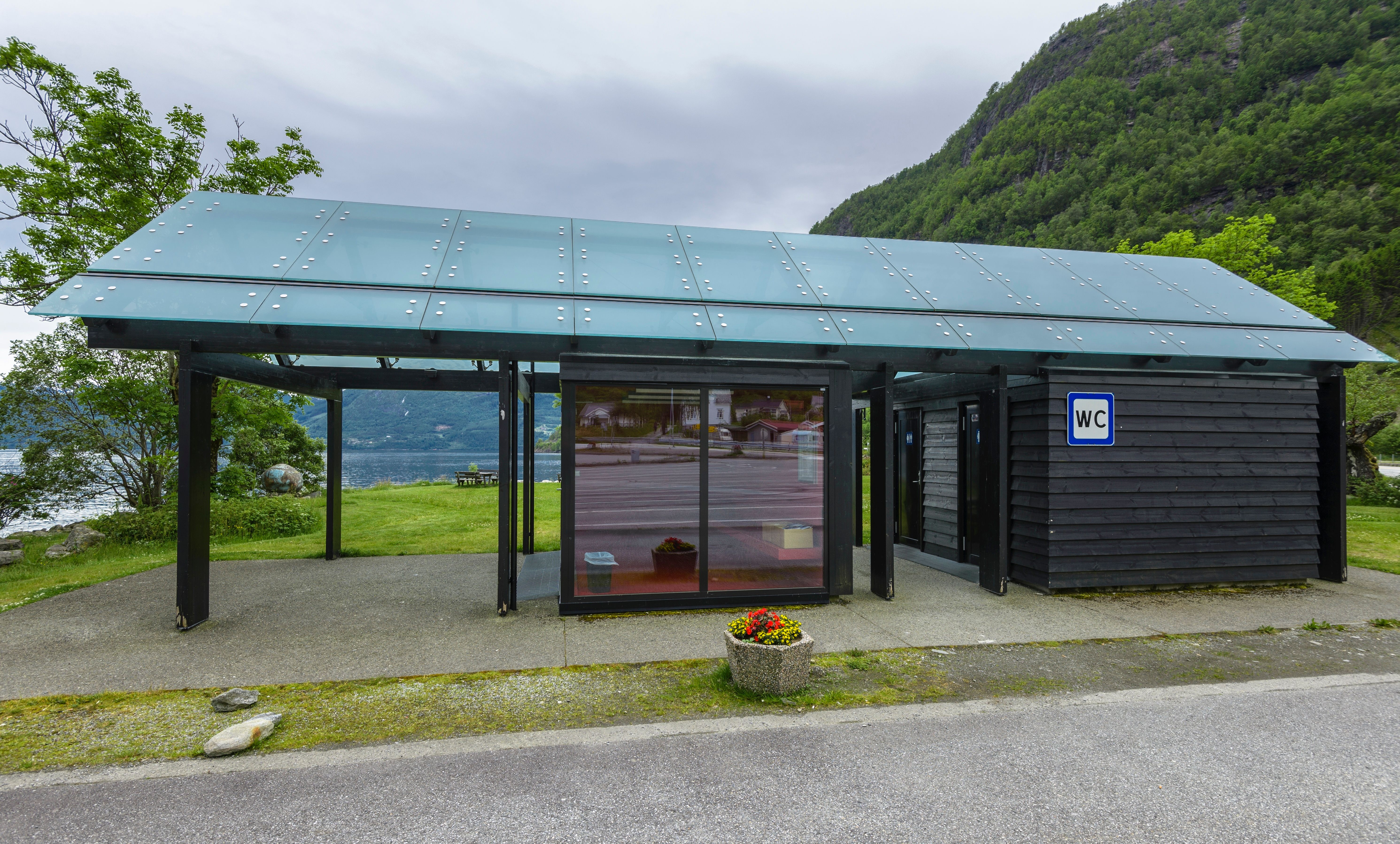A wooden and glass toilet block.