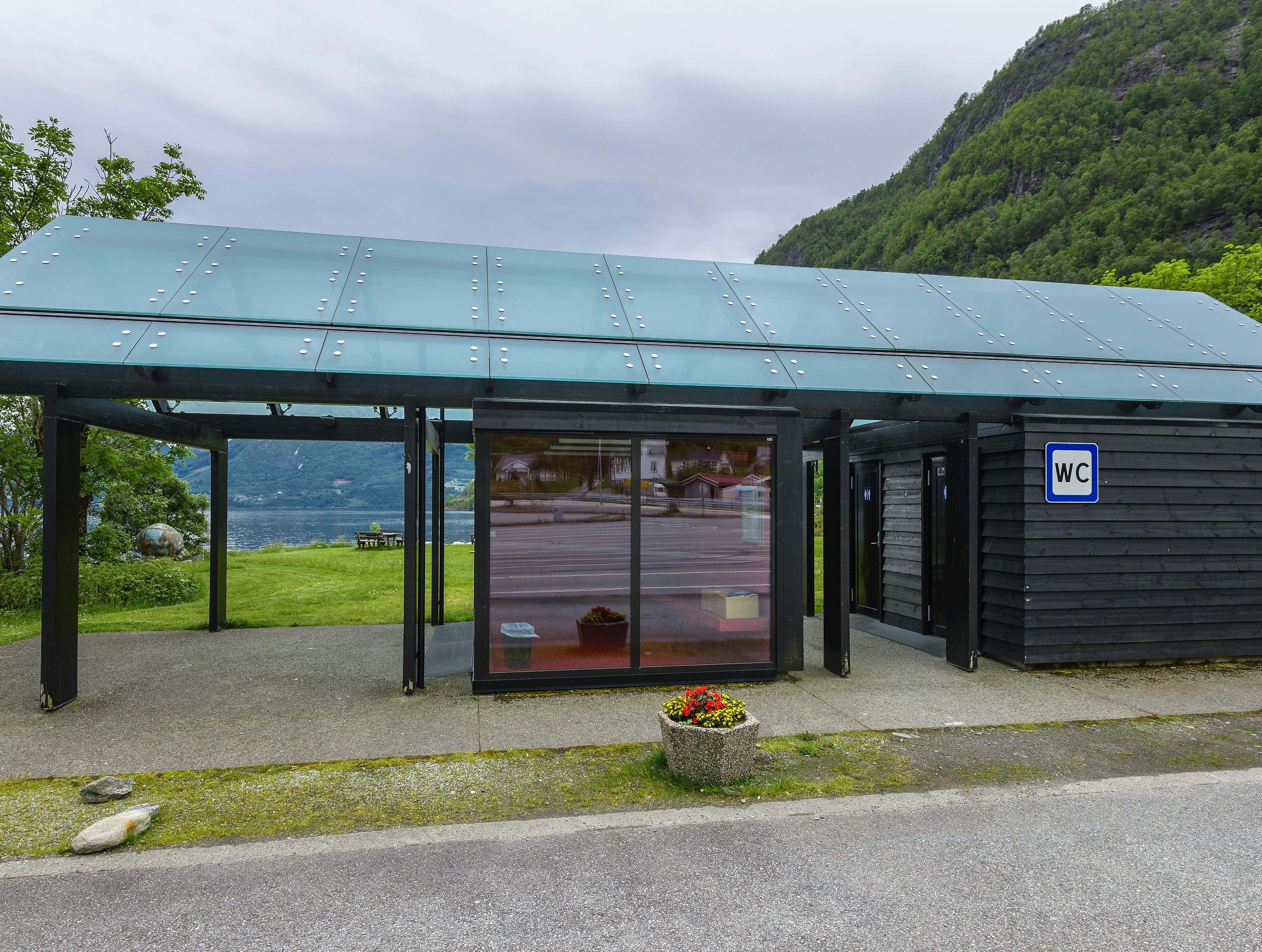 A wooden and glass toilet block.