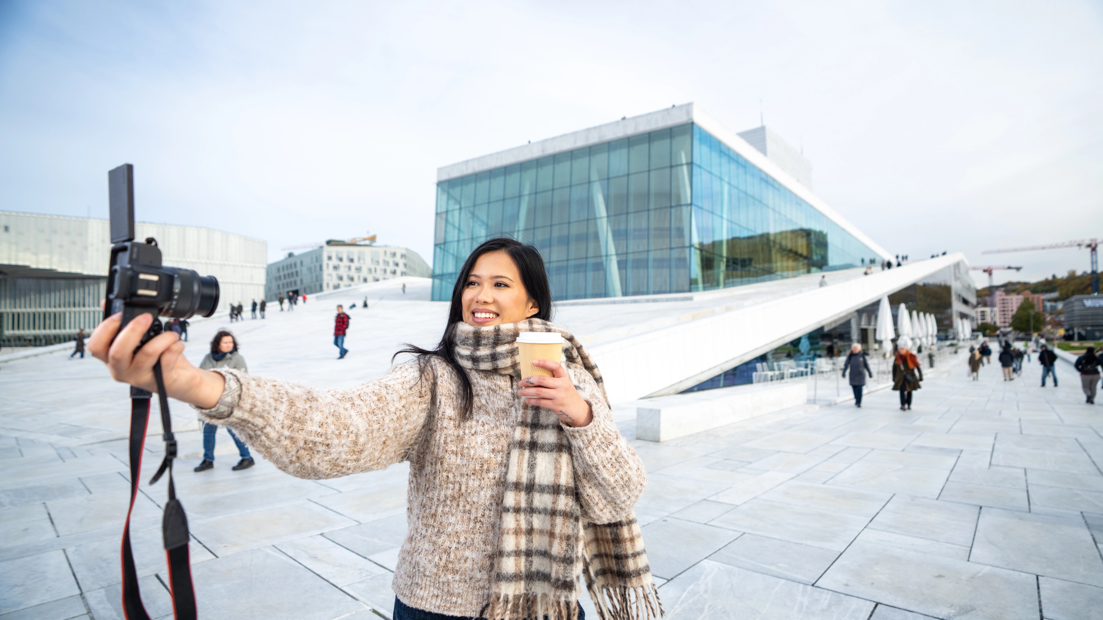 Woman by an opera house