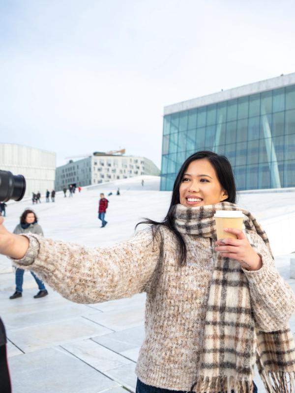 Woman by an opera house