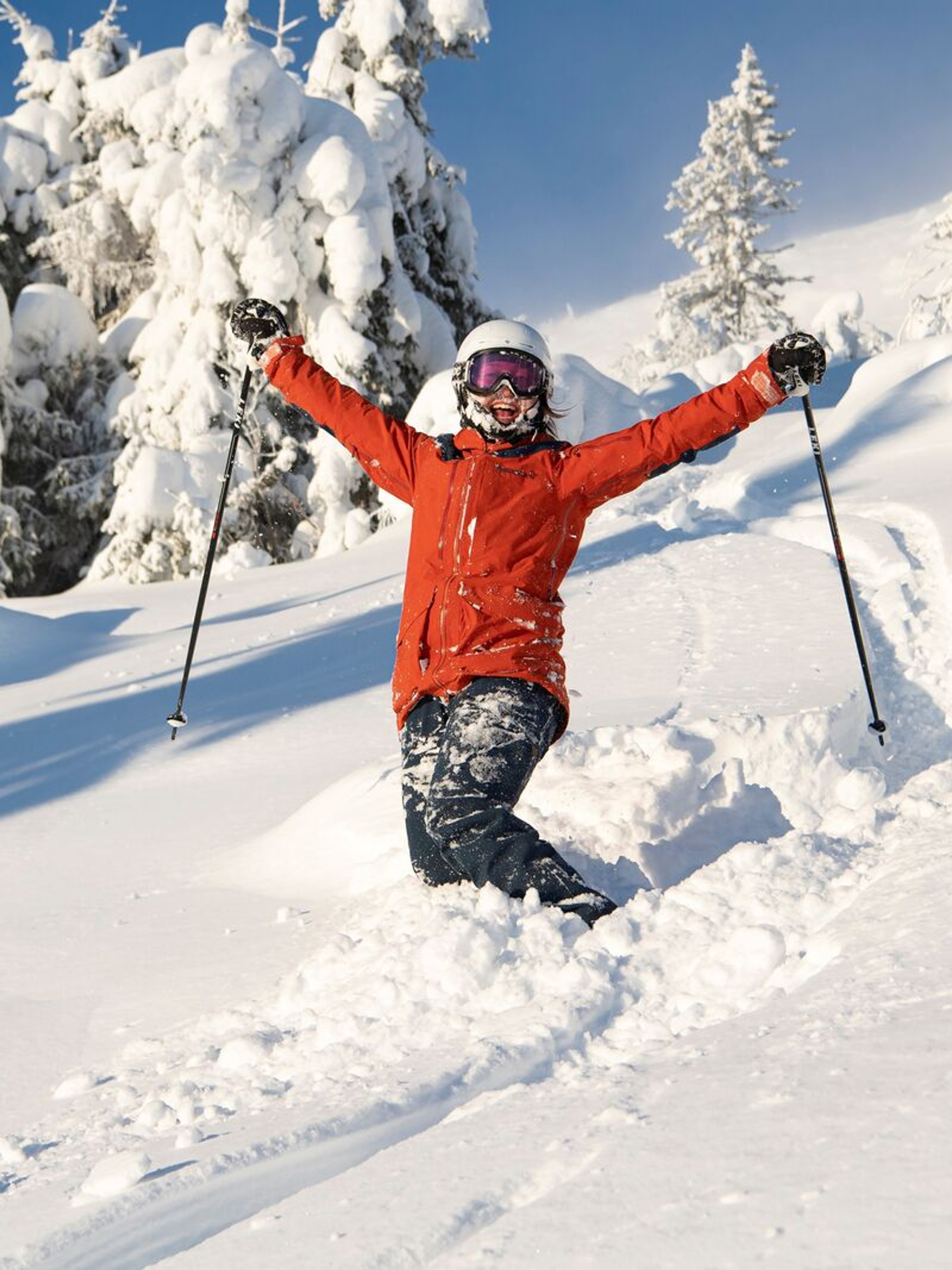Happy female skier in powder snow in Trysil
