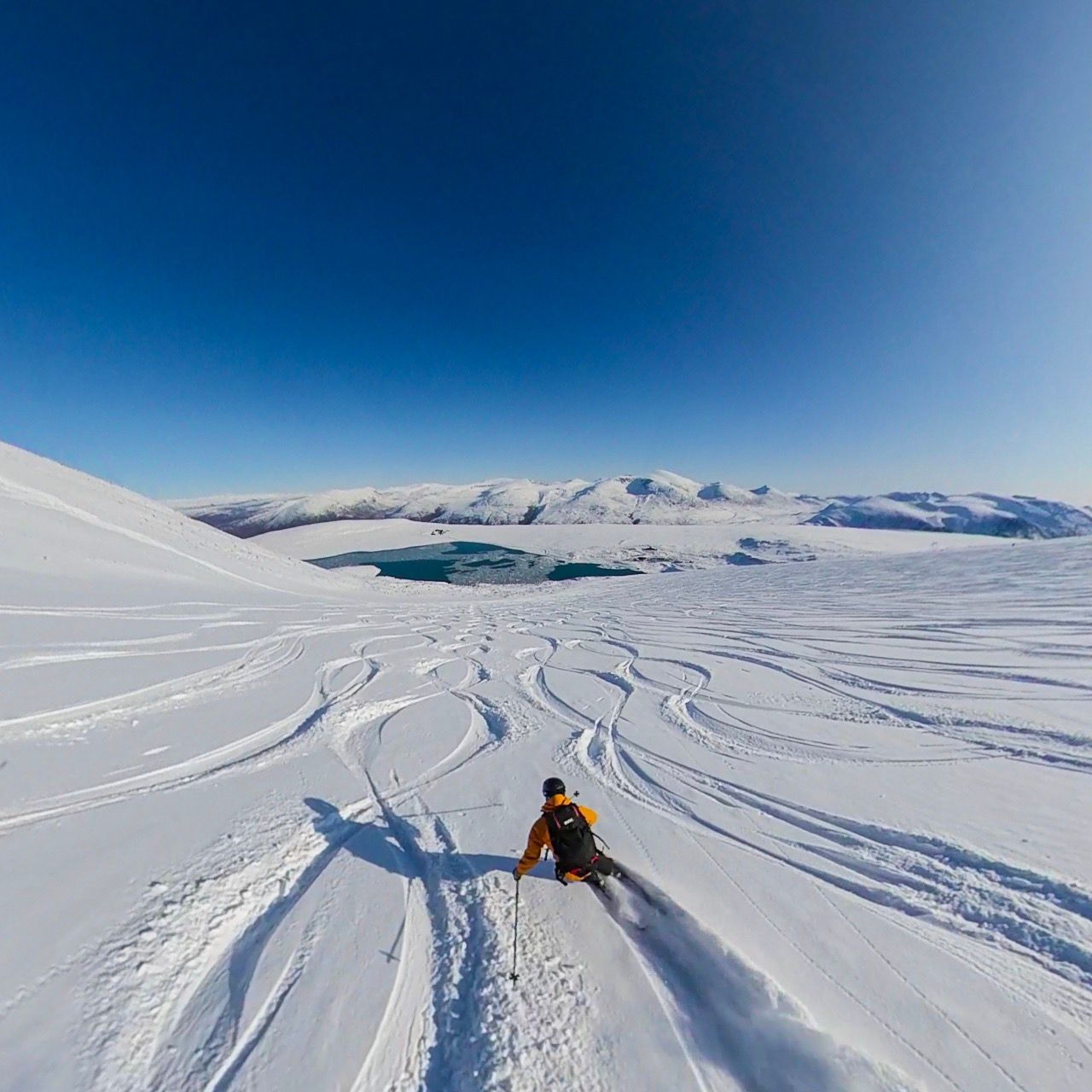 A person cruising down a slope at Galdhøpiggen summer ski centre in Jotunheimen, Eastern Norway