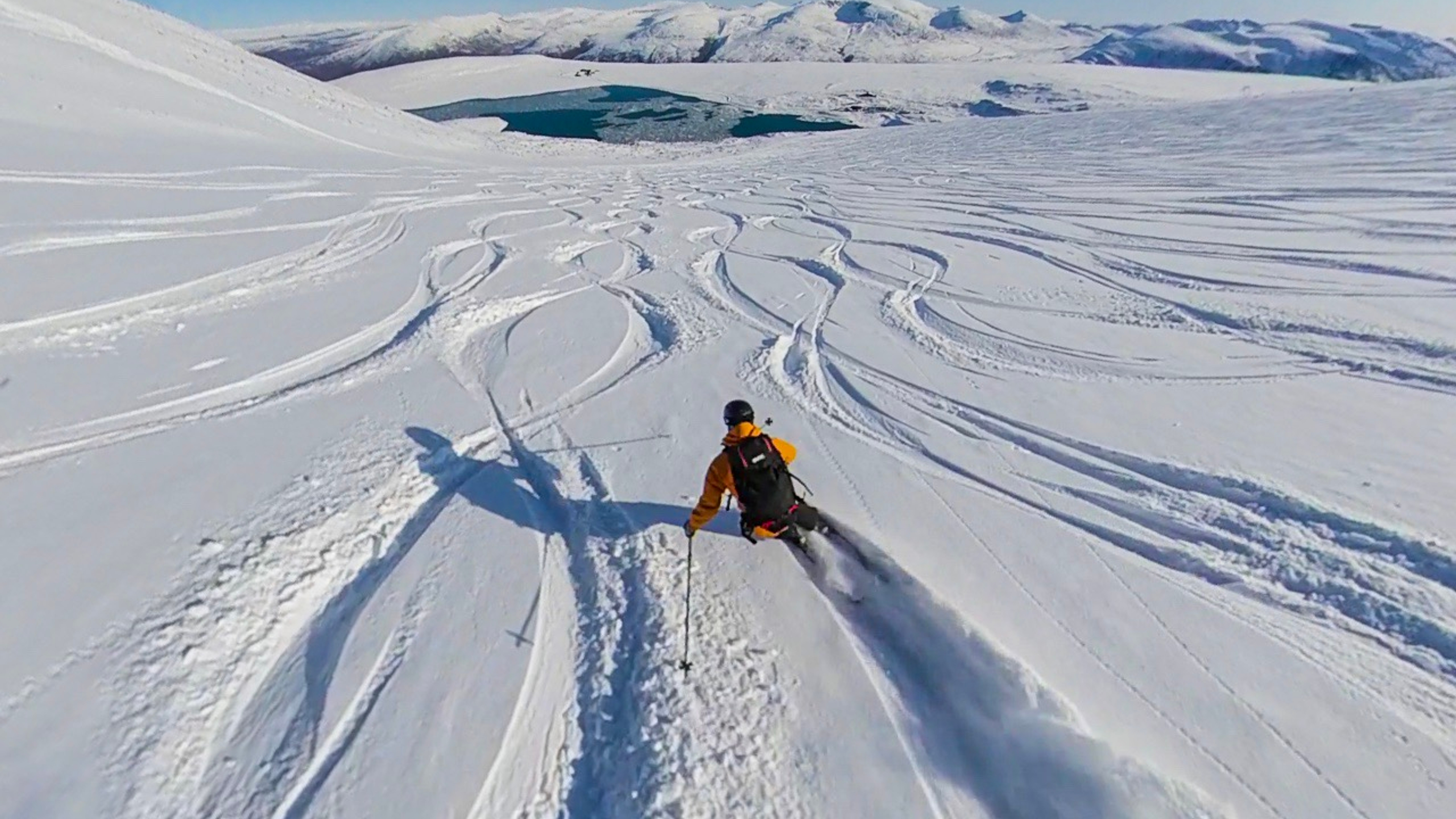A person cruising down a slope at Galdhøpiggen summer ski centre in Jotunheimen, Eastern Norway