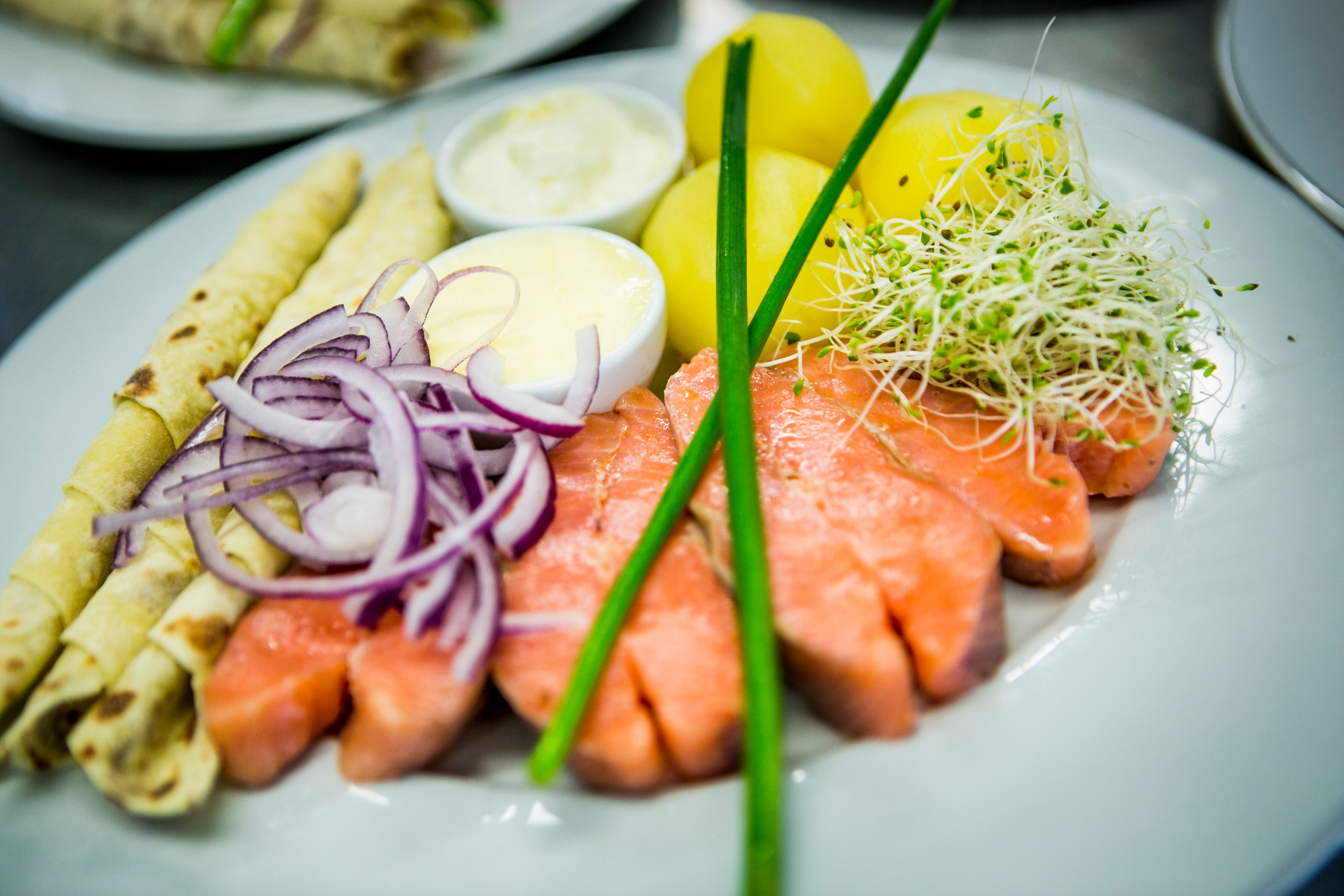 A plate of rakfisk with all the traditional trimmings, from Valdres in Norway