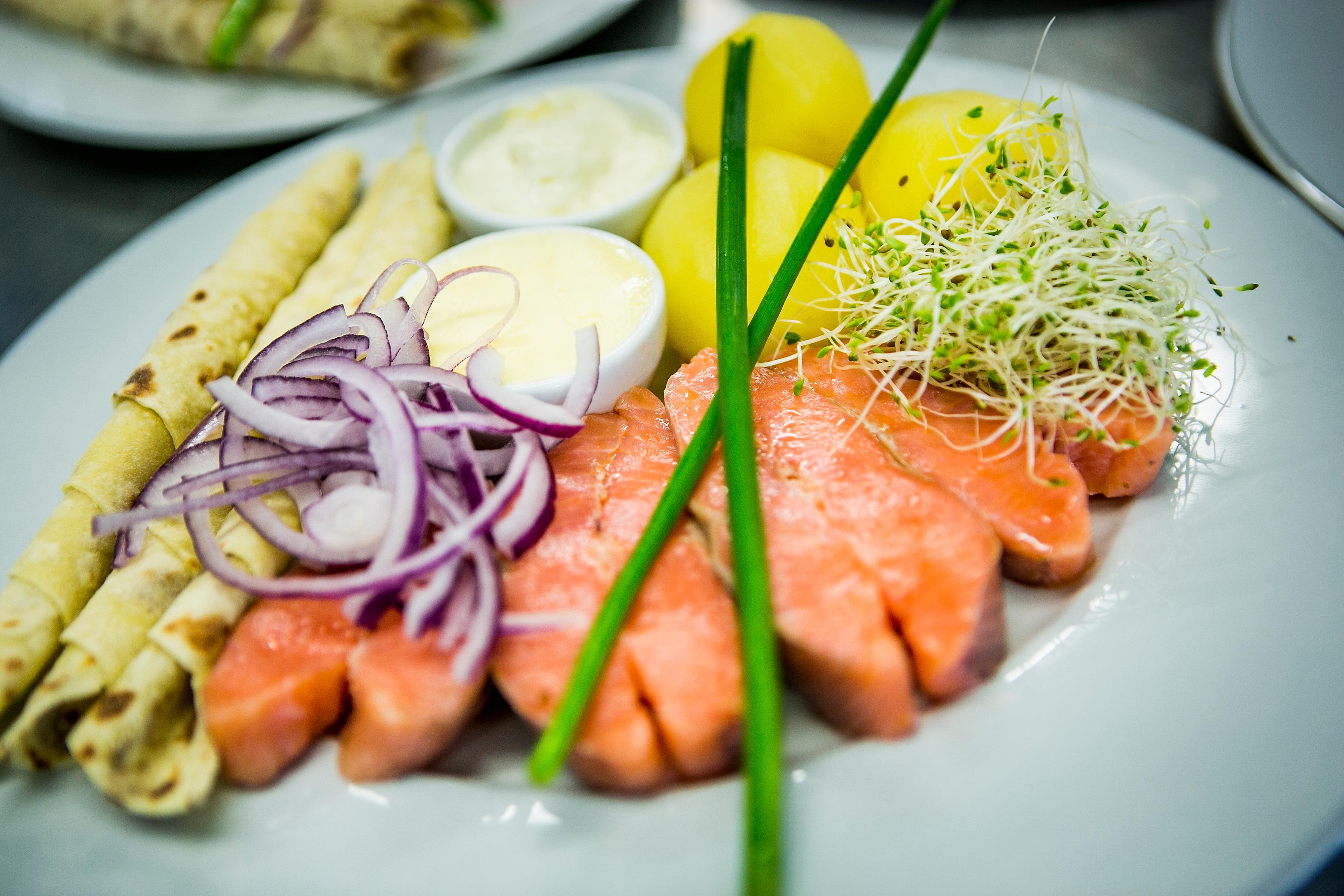 A plate of rakfisk with all the traditional trimmings, from Valdres in Norway