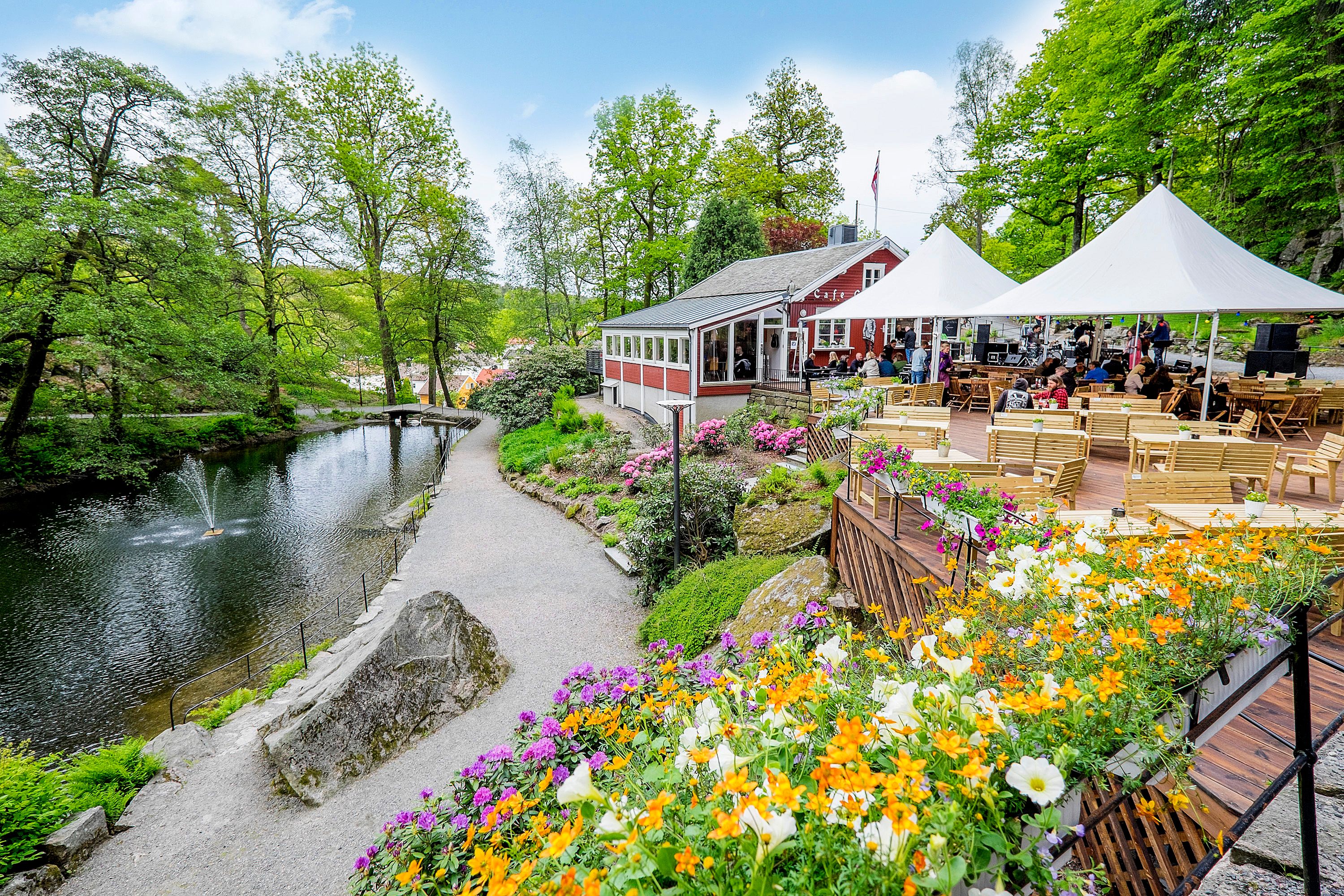Outdoor restaurant by a lake in a forest in Ravnedalen, Kristiansand. Southern Norway