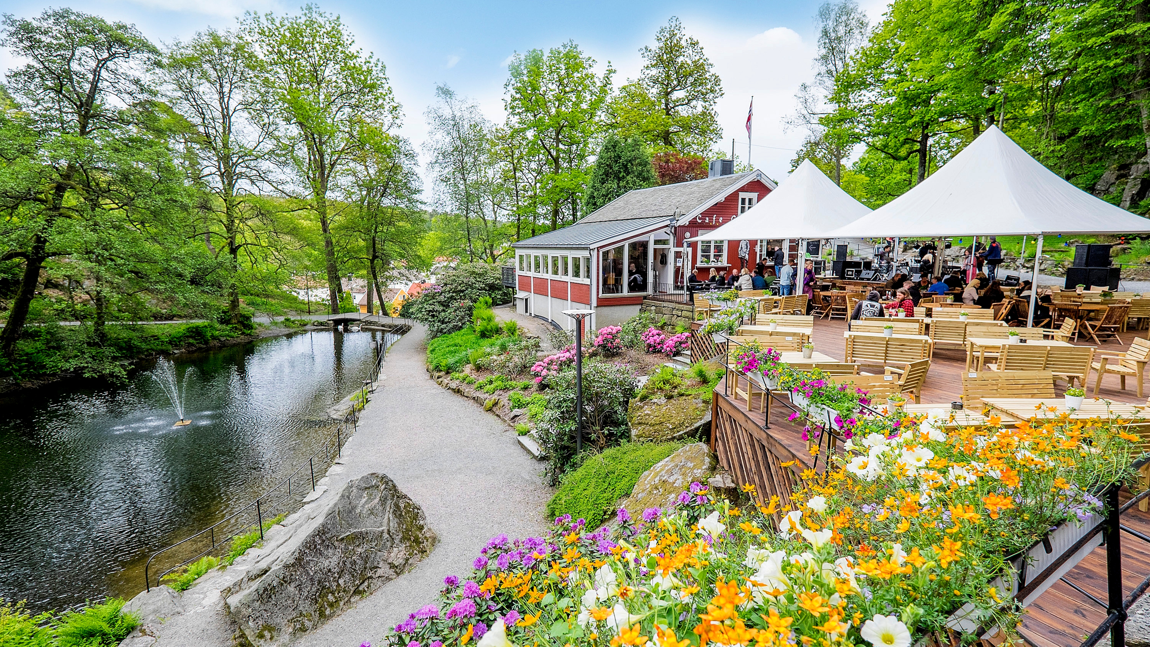 Outdoor restaurant by a lake in a forest in Ravnedalen, Kristiansand. Southern Norway
