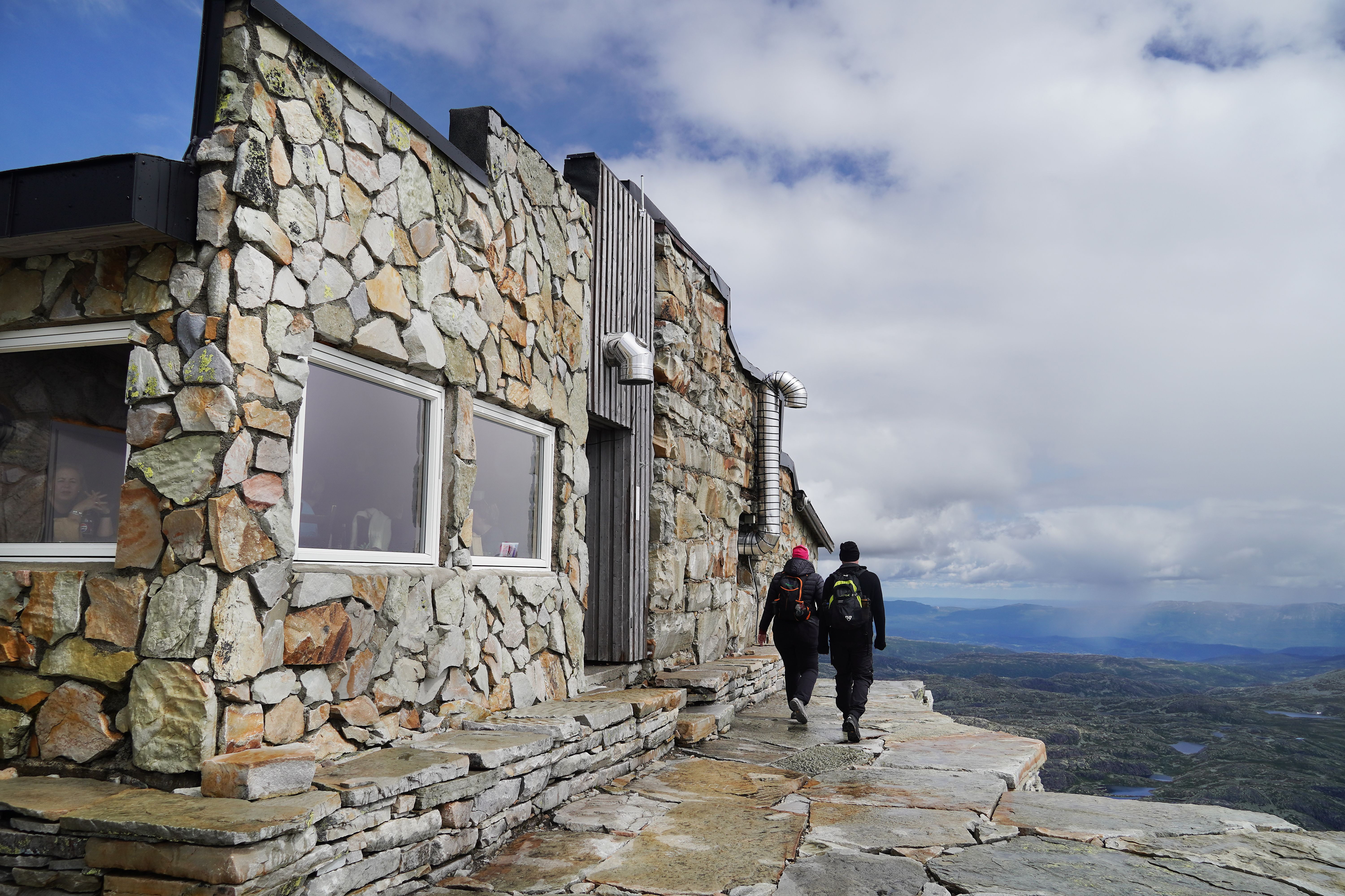 Tourist cabin in stone on top of a mountain.