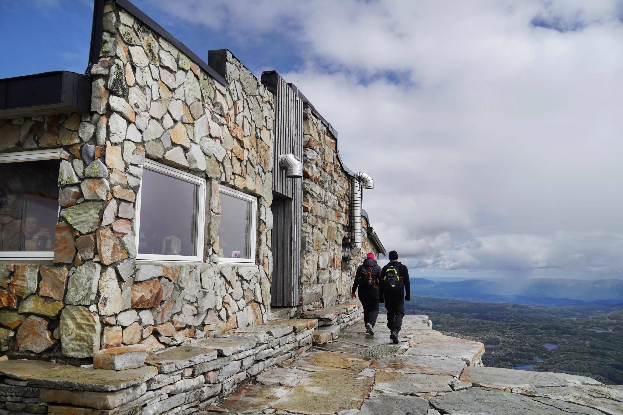 Tourist cabin in stone on top of a mountain.