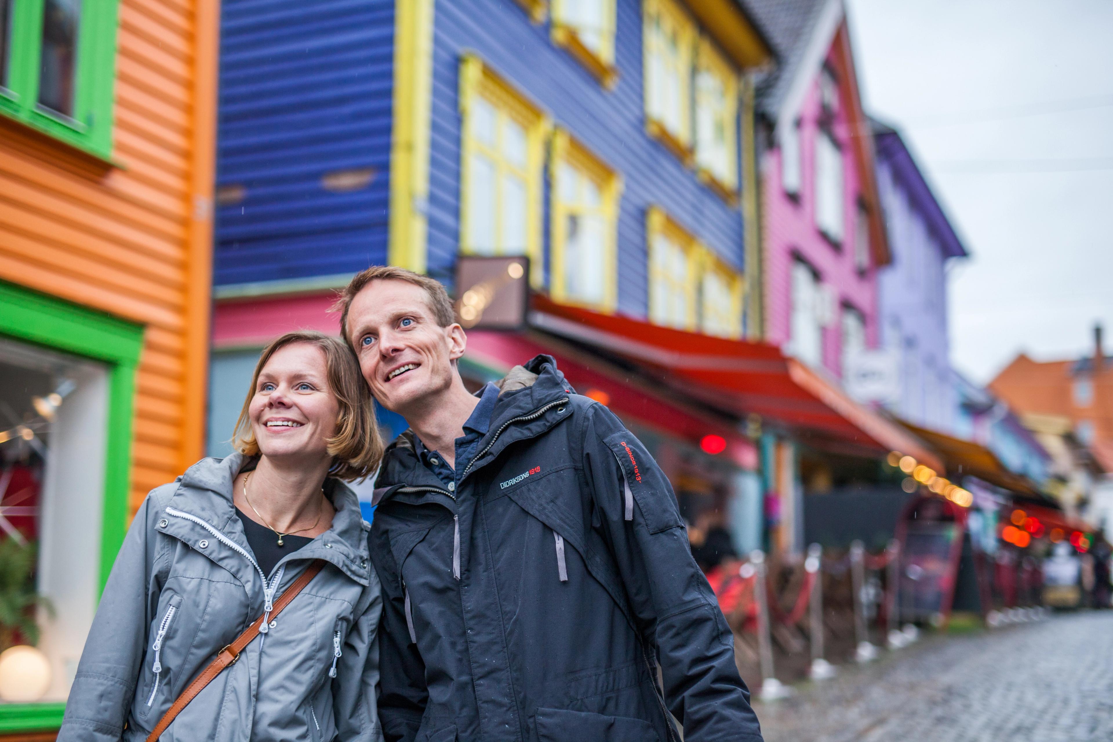 Two people on a weekend trip to Stavanger in Fjord Norway, in the colourful street Øvre Holmegate