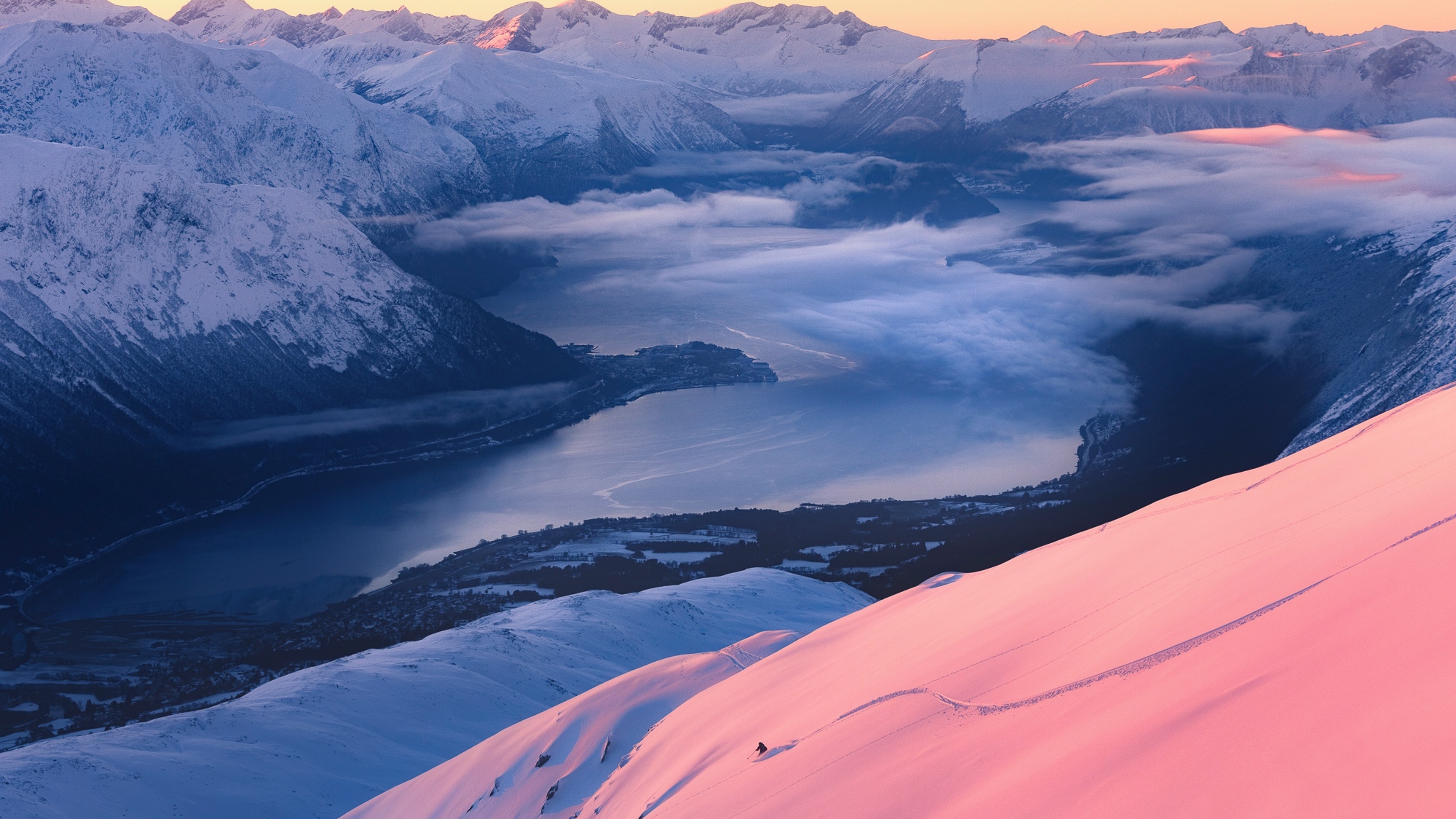 Person skiing at Kirketaket mountain in Åndalsnes, Fjord Norway