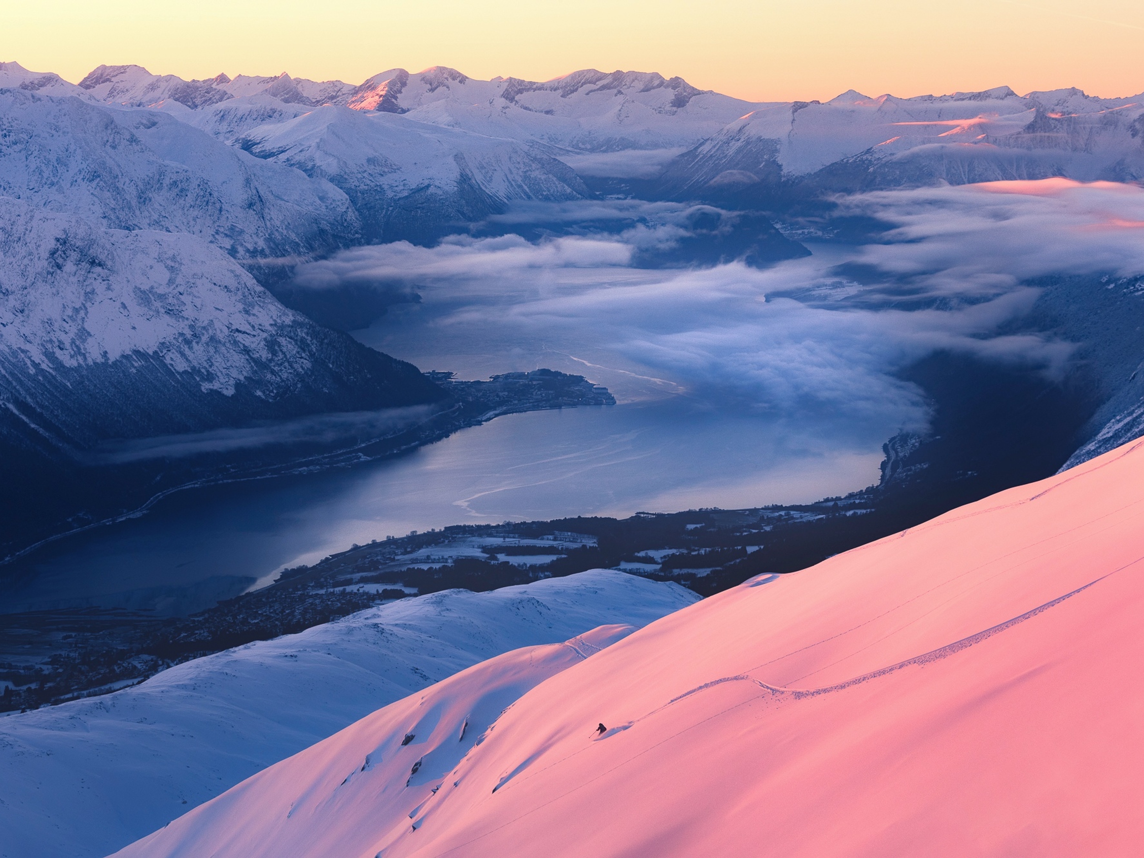 Person skiing at Kirketaket mountain in Åndalsnes, Fjord Norway