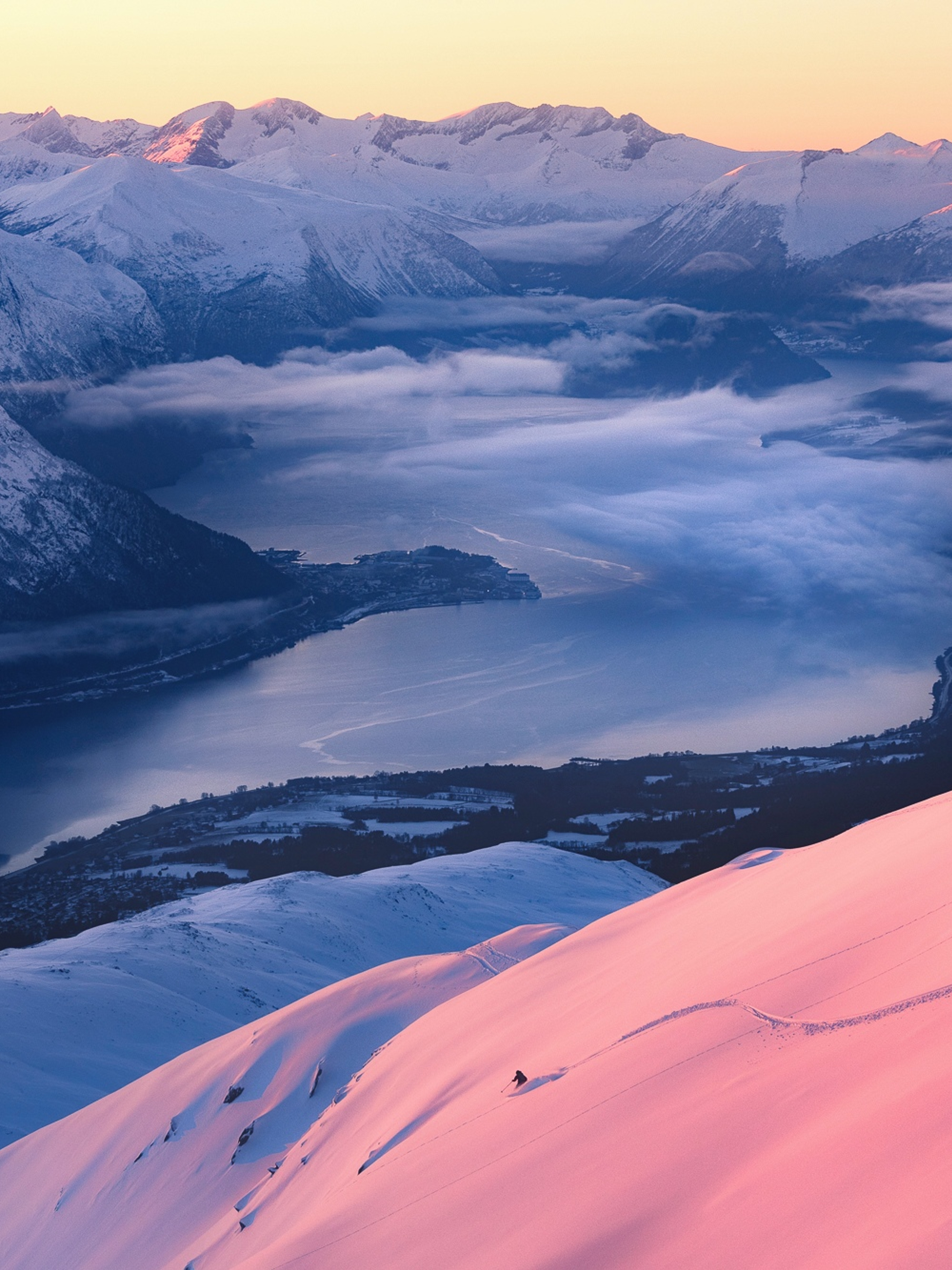 Person skiing at Kirketaket mountain in Åndalsnes, Fjord Norway