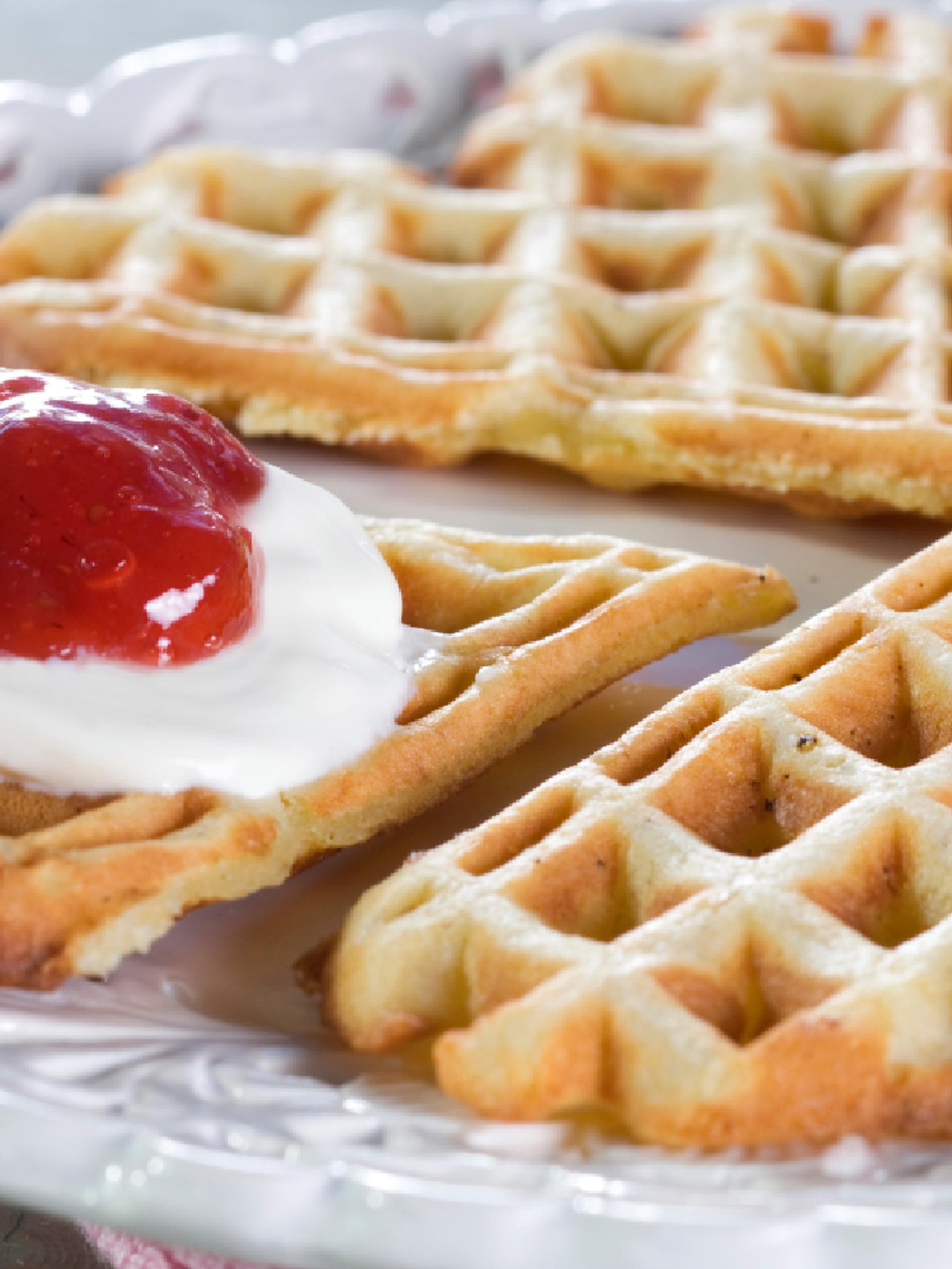 A Norwegian Waffle with sour cream and jam.