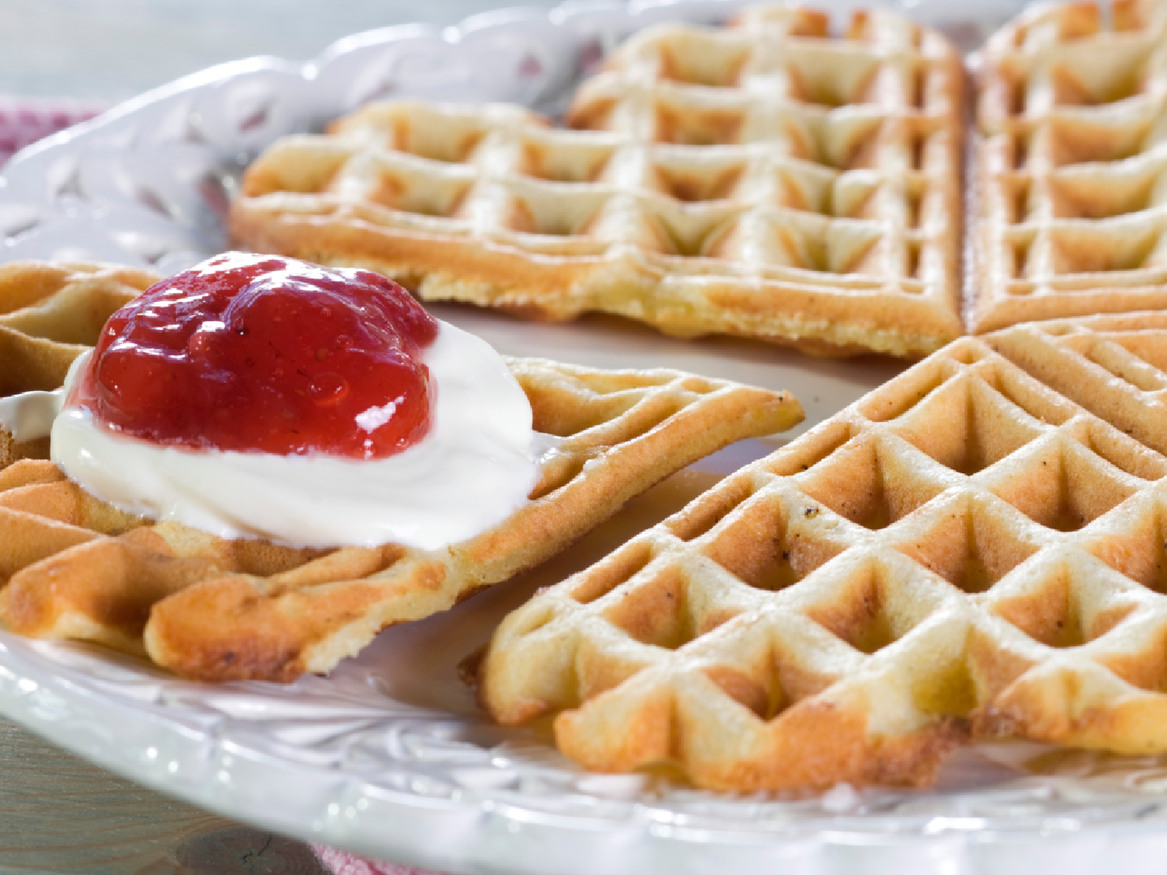 A Norwegian Waffle with sour cream and jam.