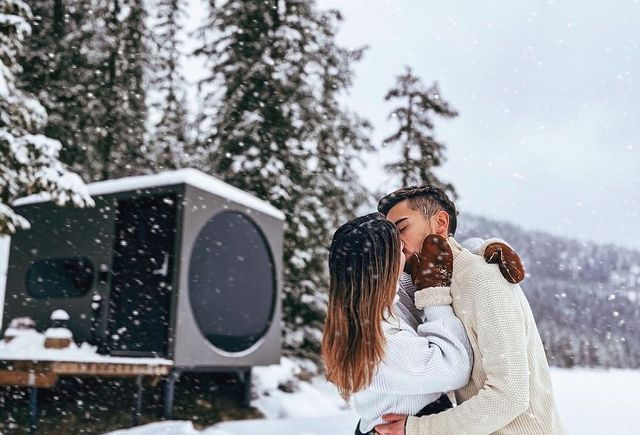 Couple kissing in front of Birdbox in Fauske, Northern Norway