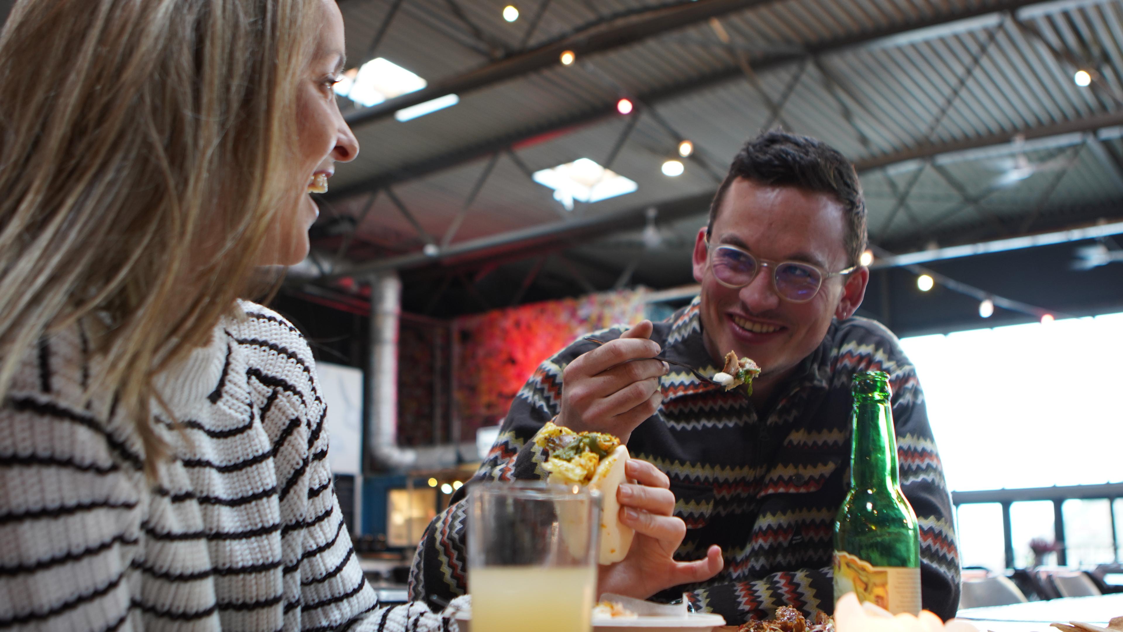 Friends eating food at Vippa in Oslo