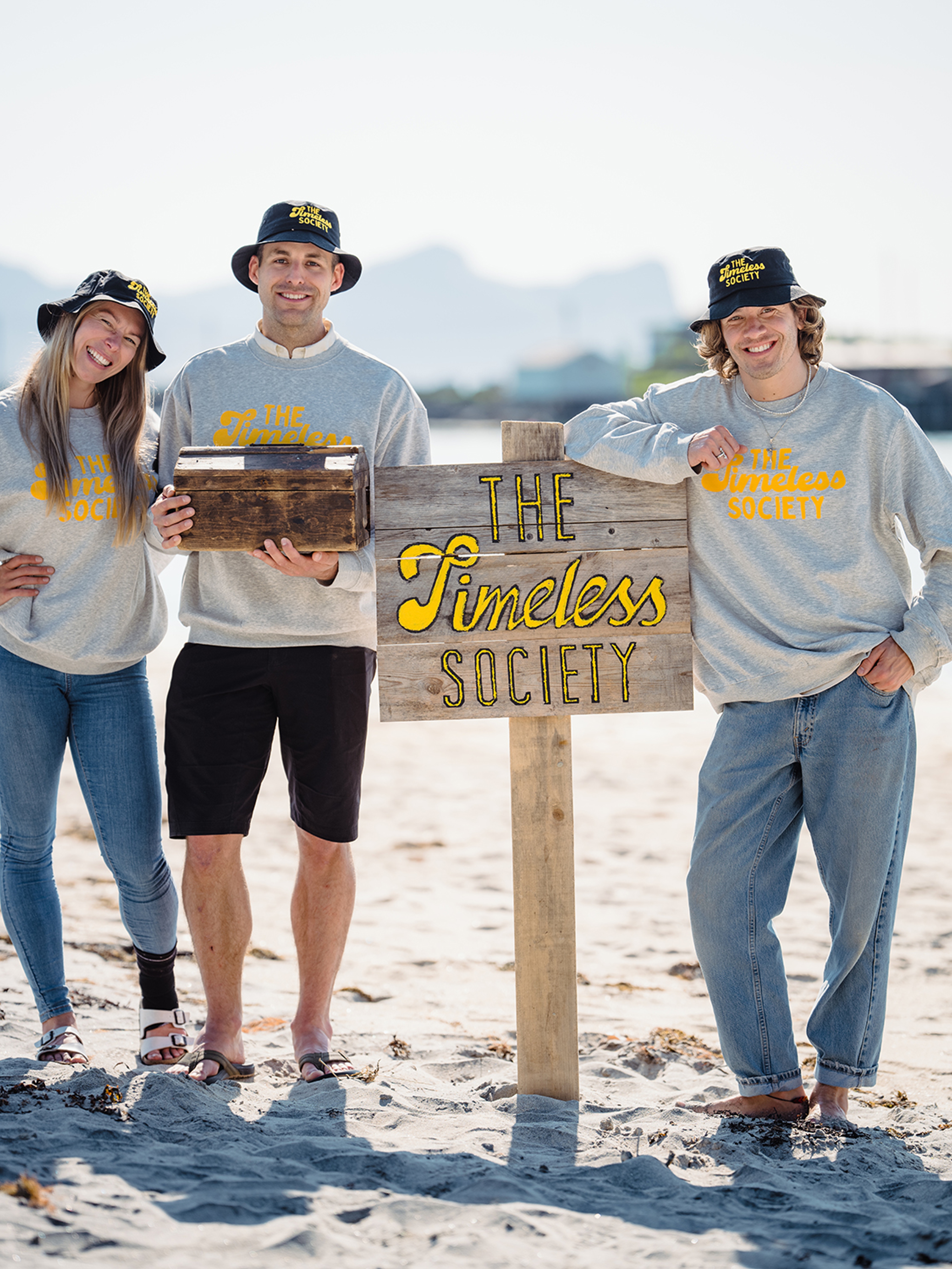 Visitors by sign that says Timeless Society in Senja