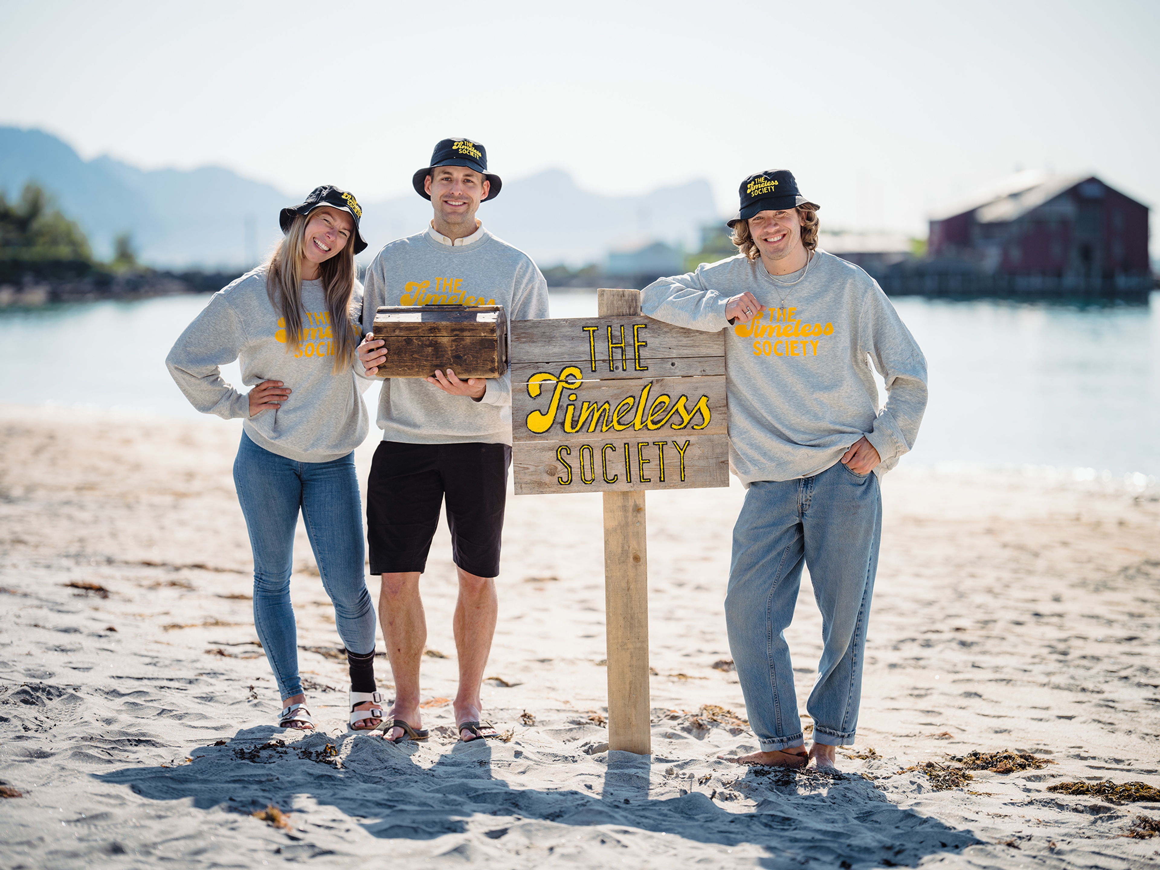 Visitors by sign that says Timeless Society in Senja