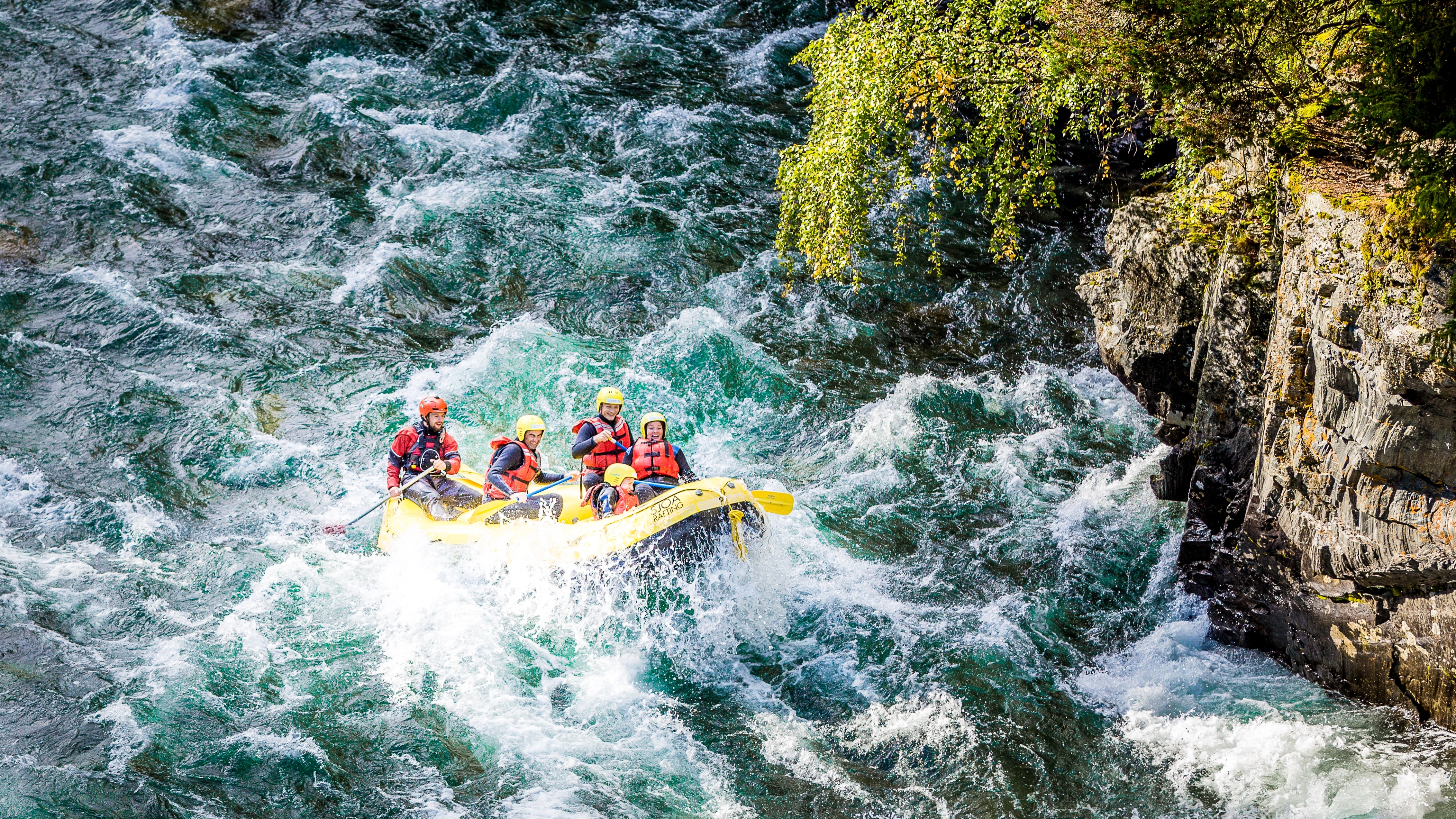 A group of people white water rafting in Sjoa river in the Jotunheimen mountains in Eastern Norway