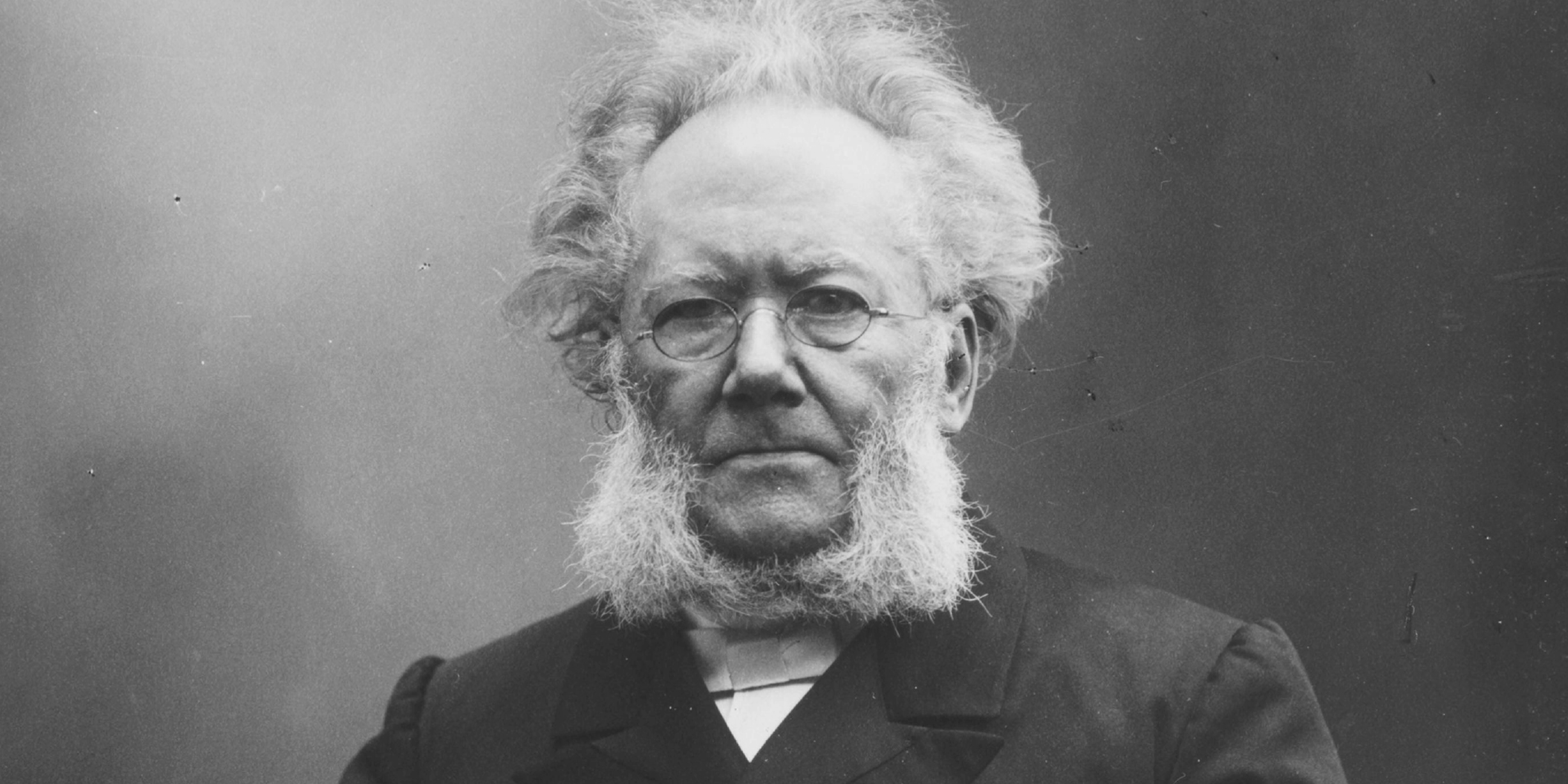 The Norwegian playwright and poet Henrik Ibsen sitting down. Black and white photo.