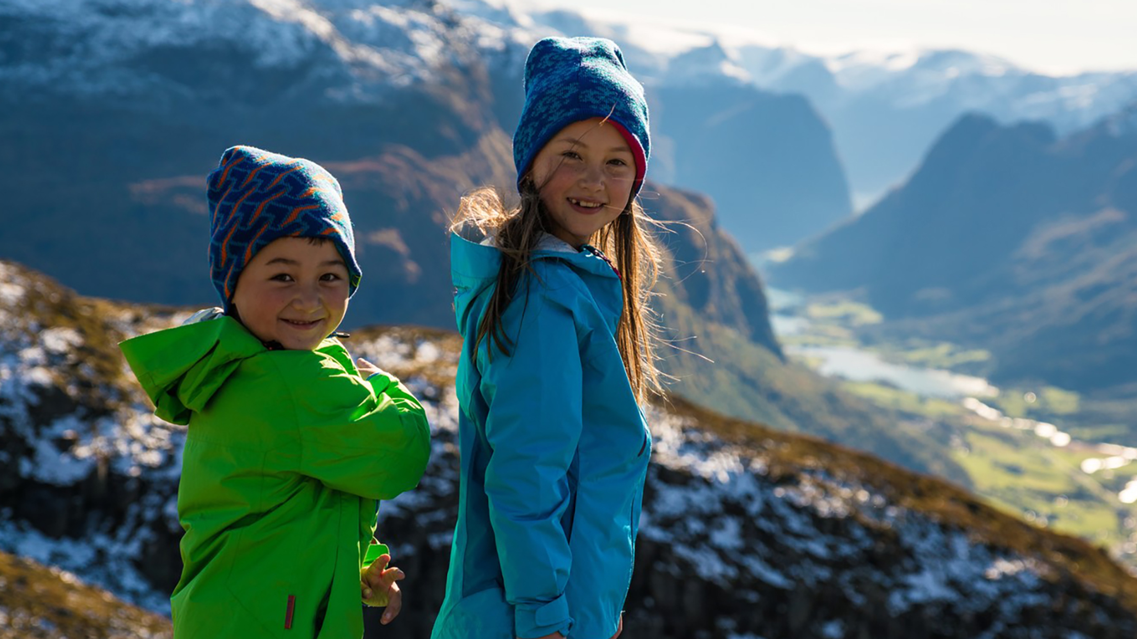 Two children are hiking in the mountains in Stryn, Fjord Norway.