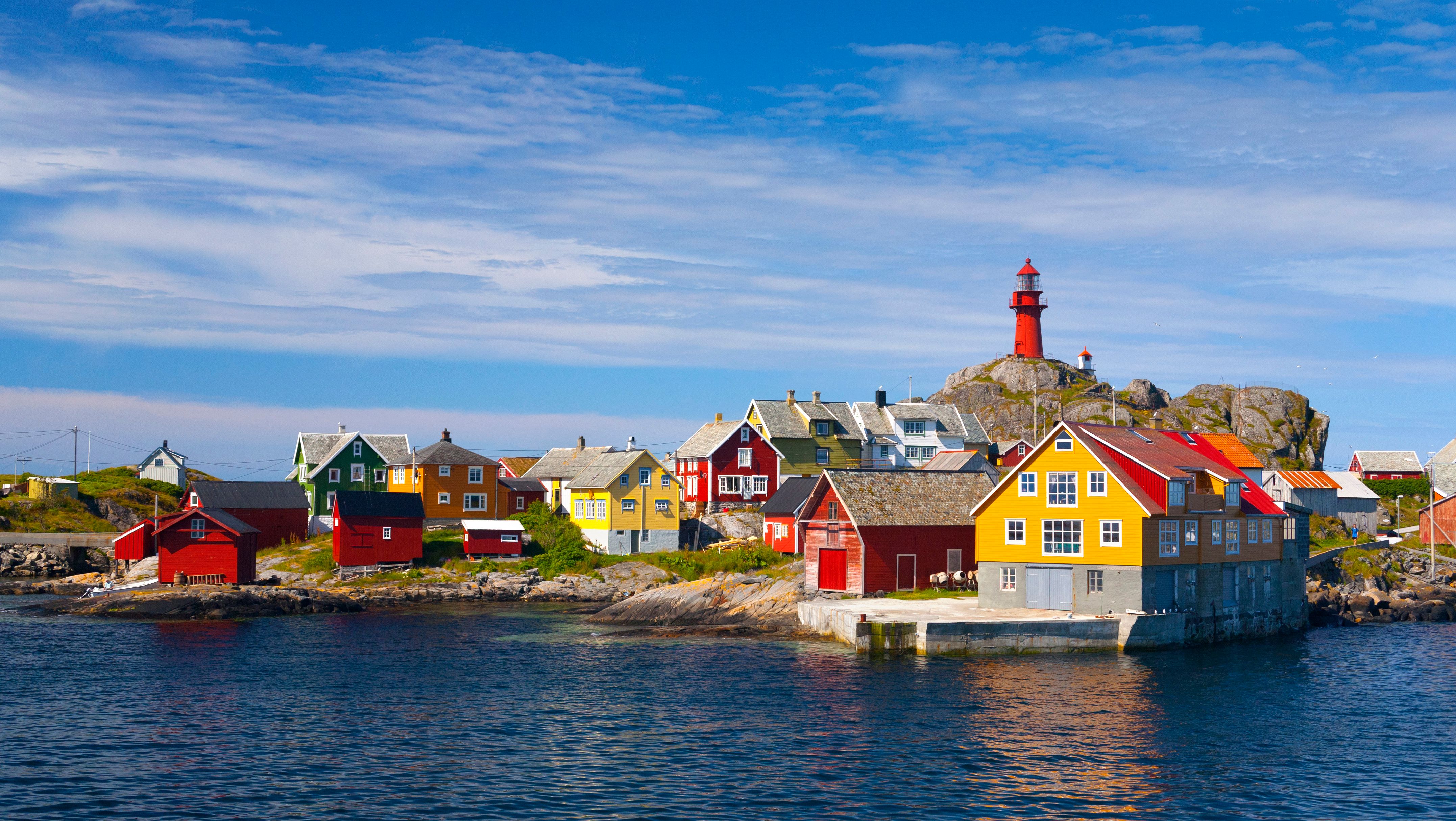 The Ona Lighthouse in Fjord Norway seen from the sea