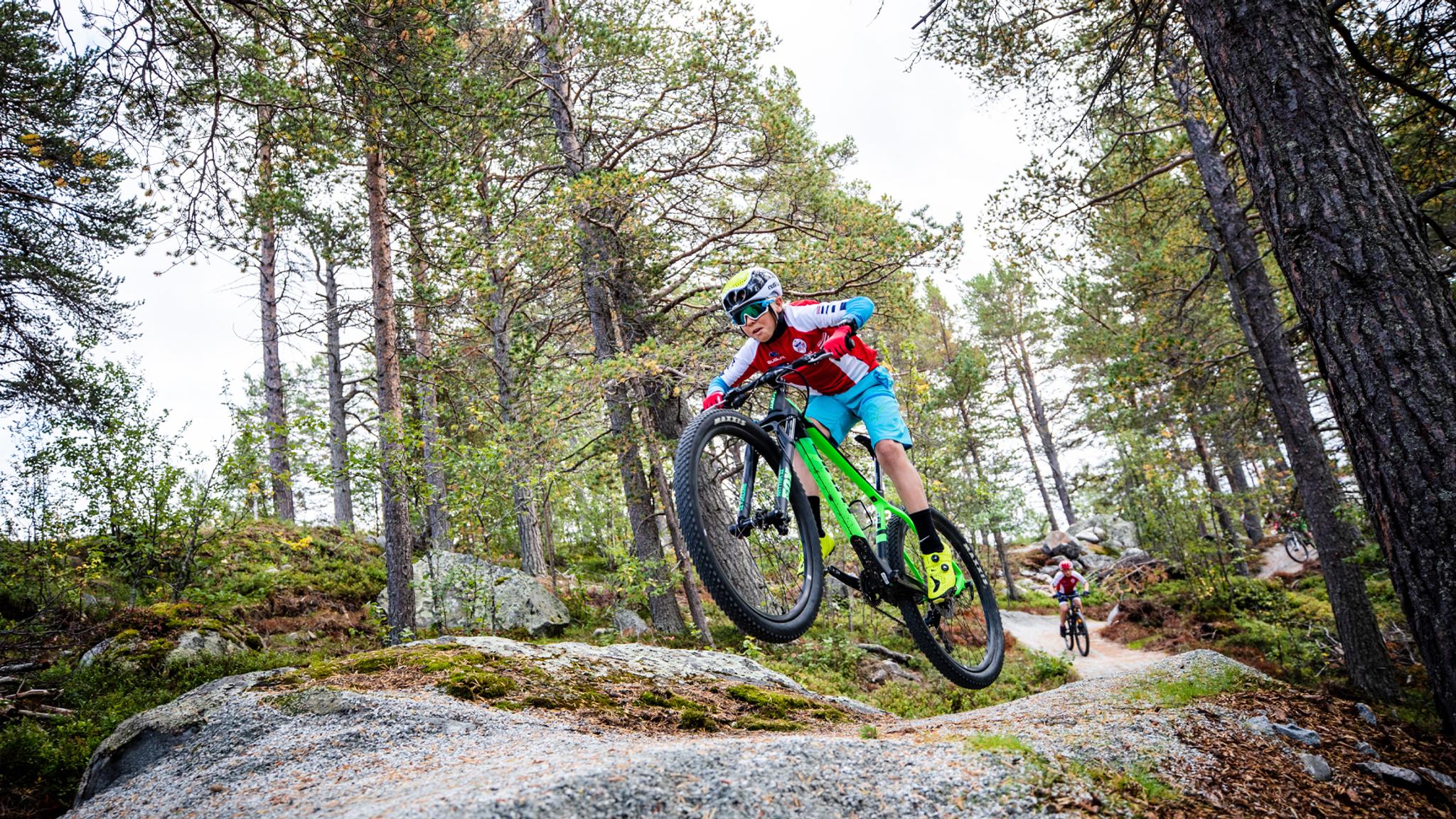 A child mountain biking in Geilo bike park in Hallingdal, Eastern Norway