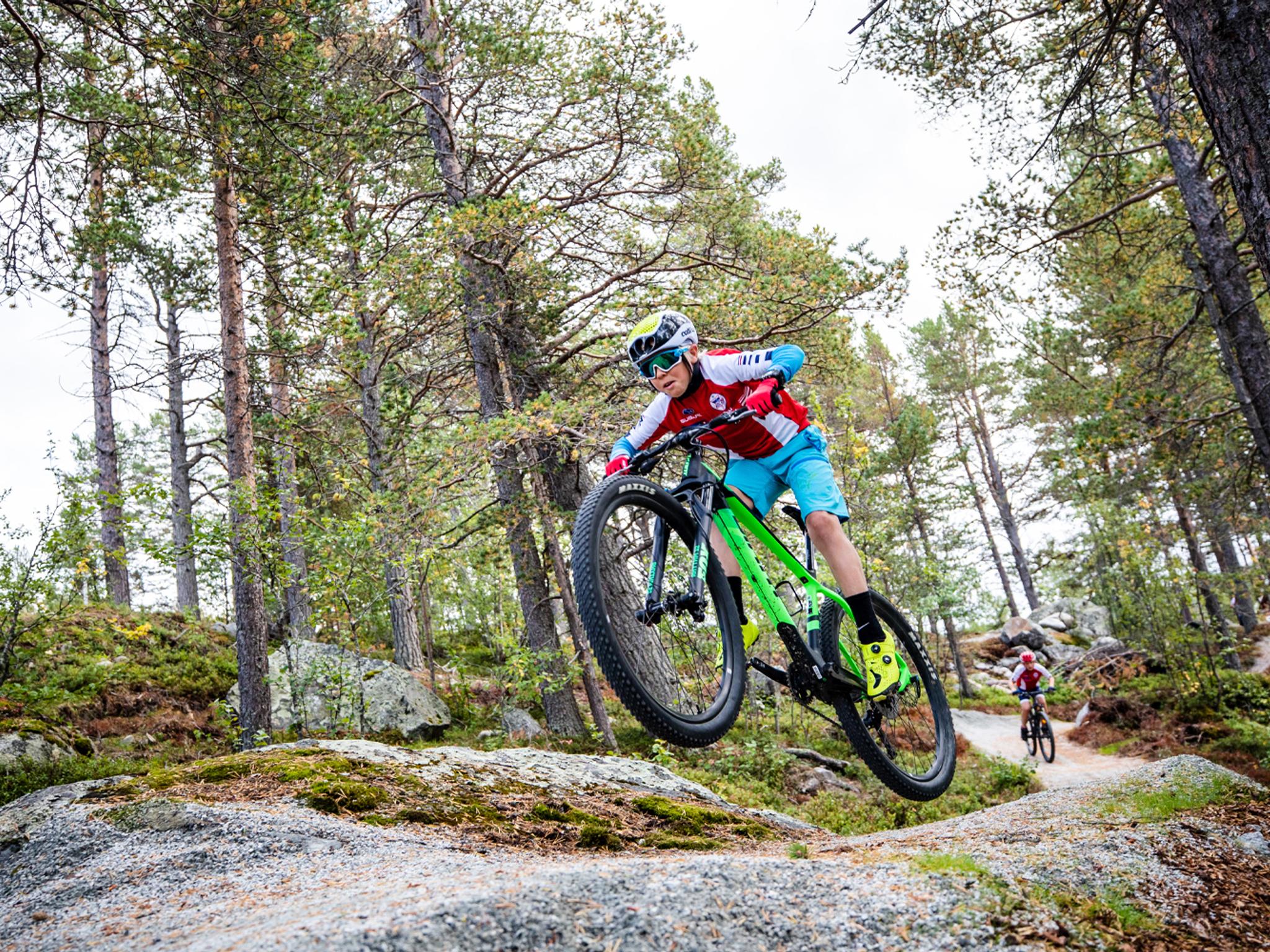 A child mountain biking in Geilo bike park in Hallingdal, Eastern Norway