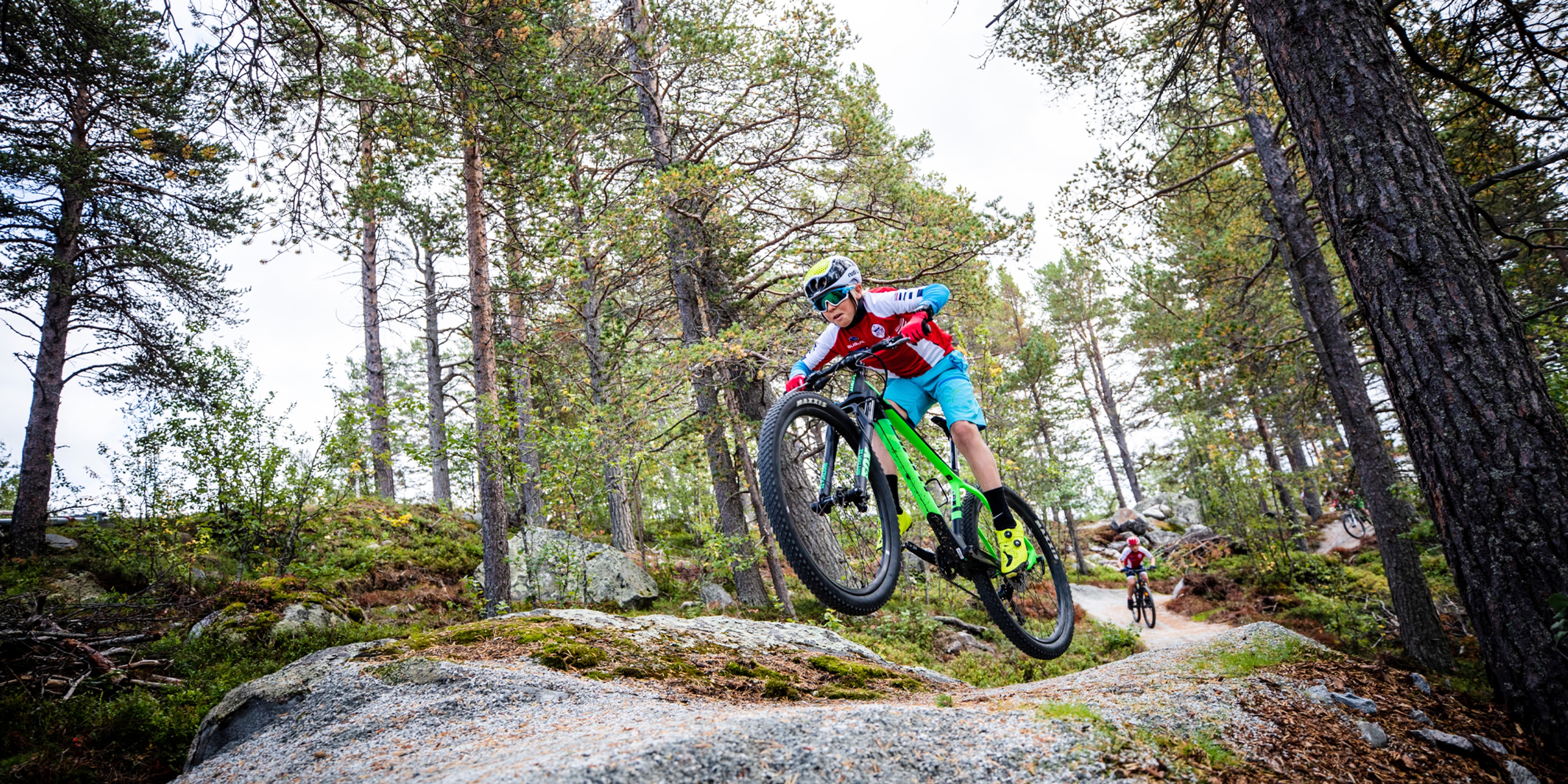 A child mountain biking in Geilo bike park in Hallingdal, Eastern Norway