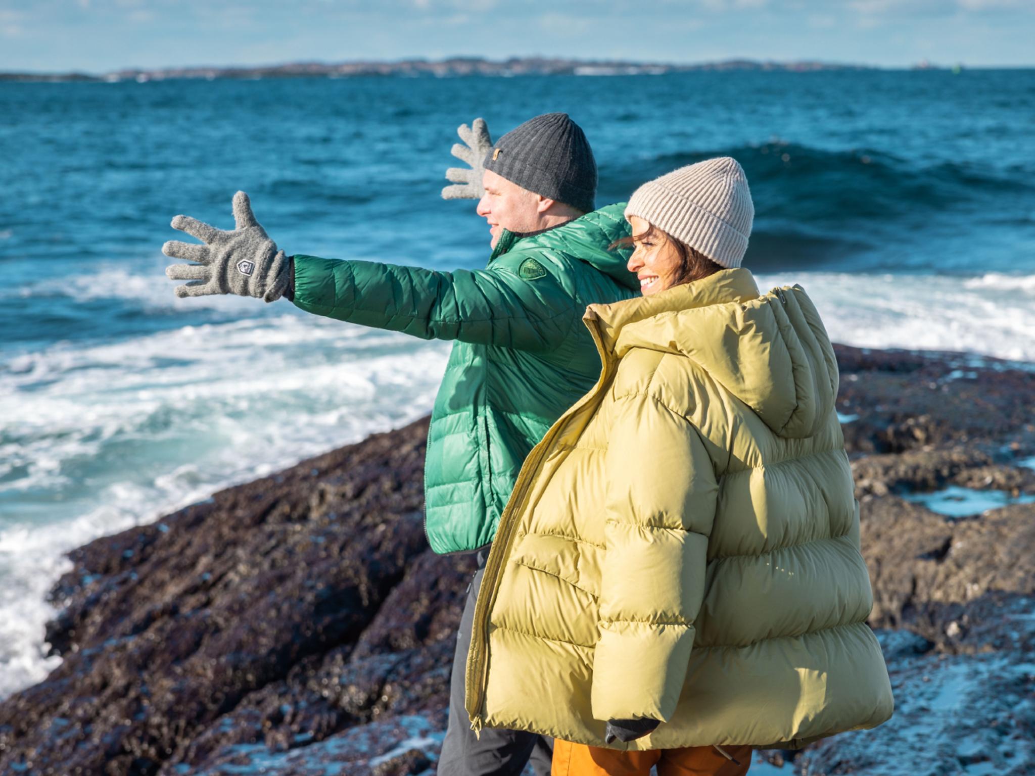 A couple by the sea.