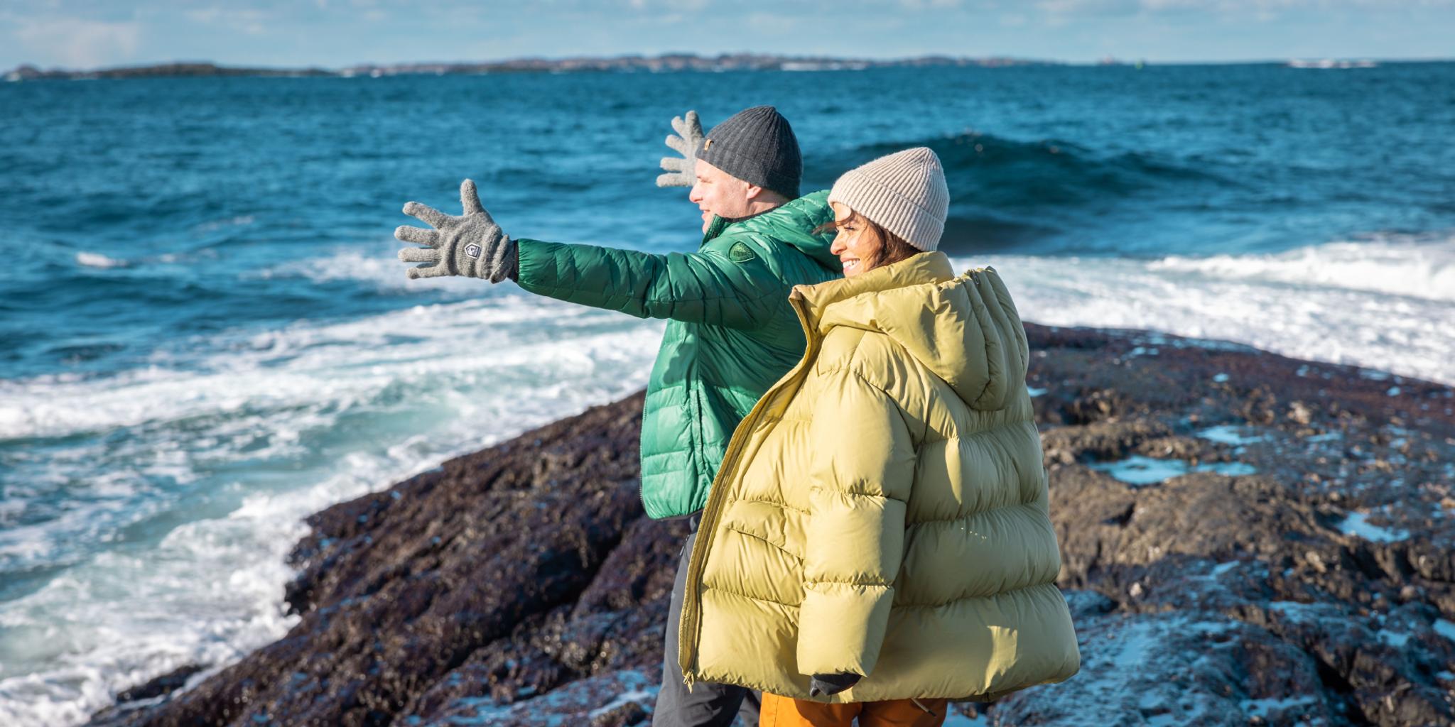 A couple by the sea.