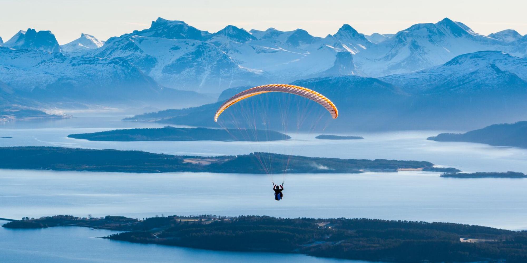 Person paragliding by Tusten in Molde, Møre og Romsdal