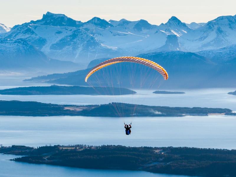 Person paragliding by Tusten in Molde, Møre og Romsdal