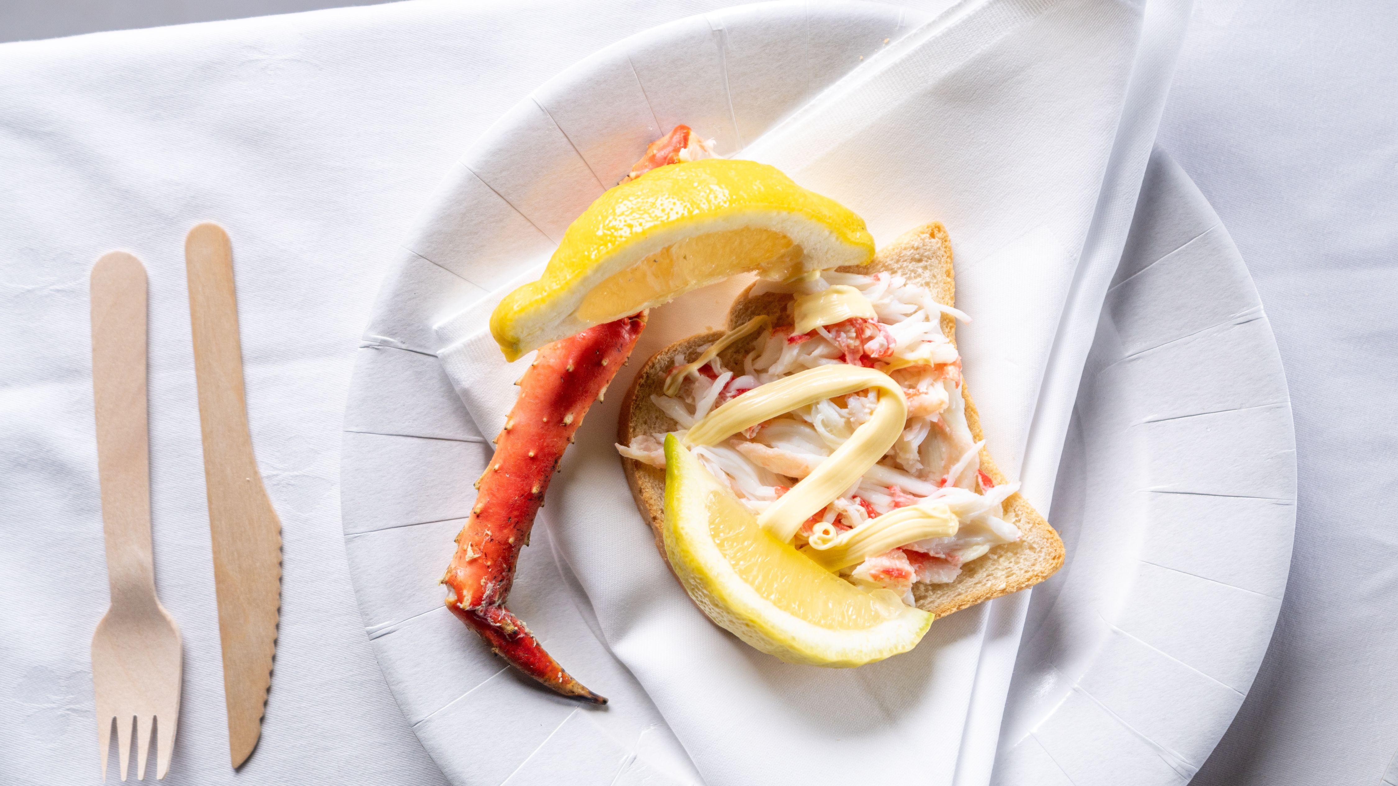 King crab served on bread with mayonnaise and lemon.