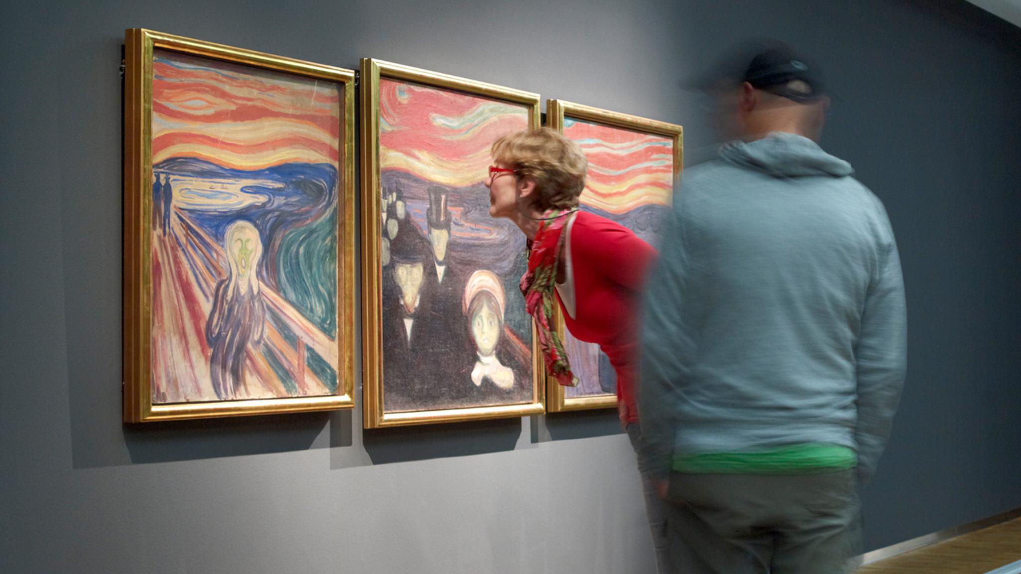 People looking at Edvard Munch’s Scream at The Munch Museum in Oslo