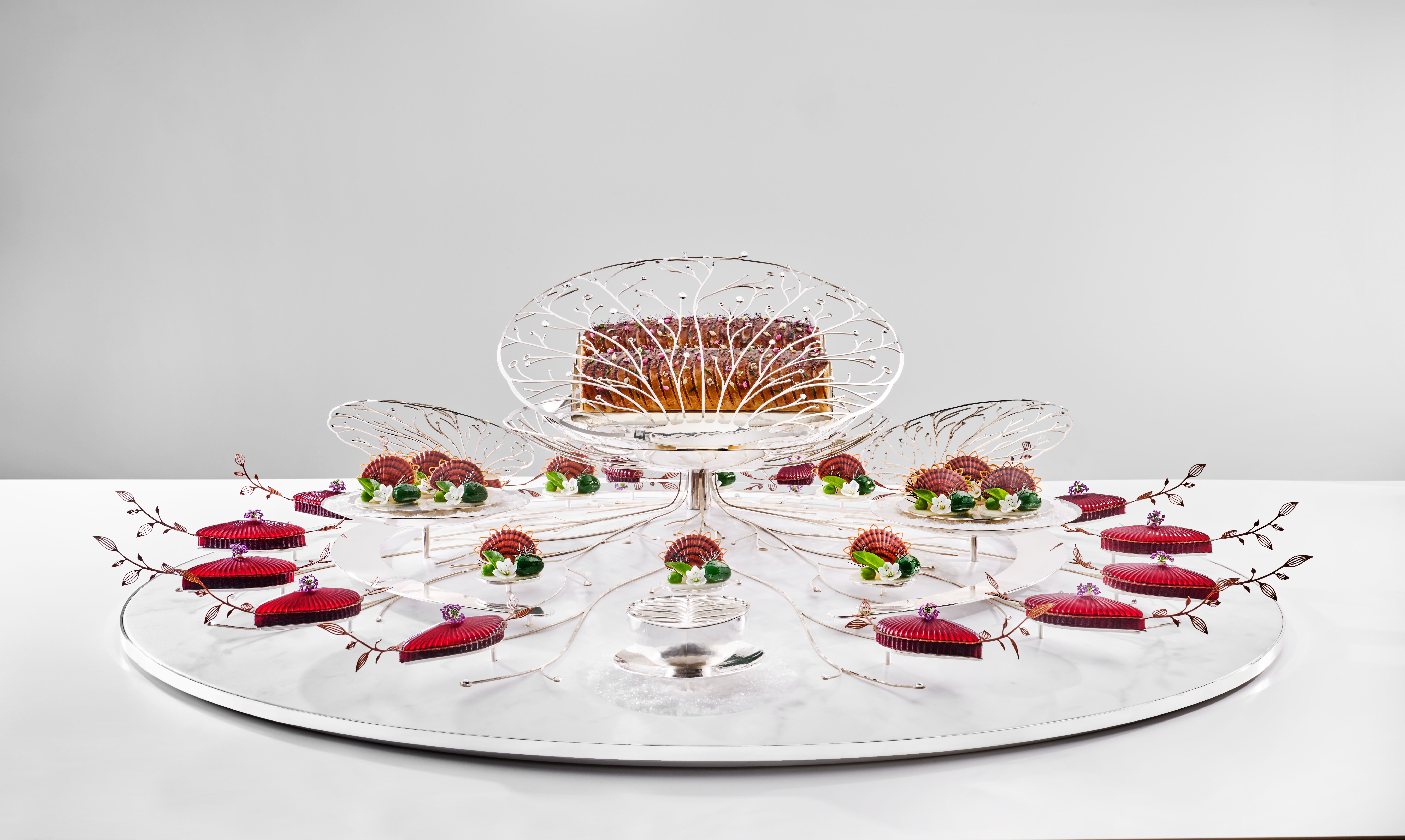 Skrei, beetroot, jerusalem artichoke and more beautifully arranged on a glass plate