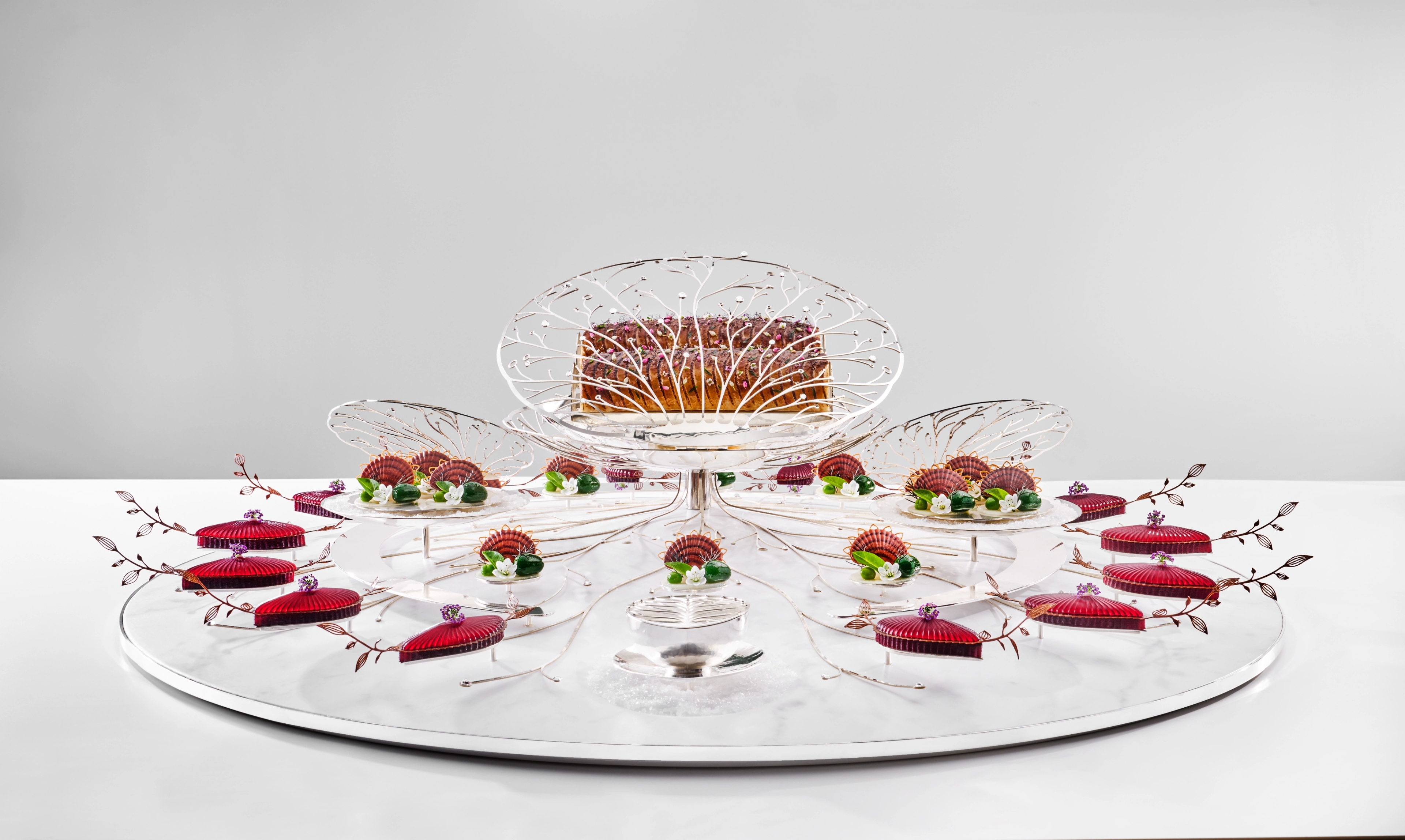 Skrei, beetroot, jerusalem artichoke and more beautifully arranged on a glass plate