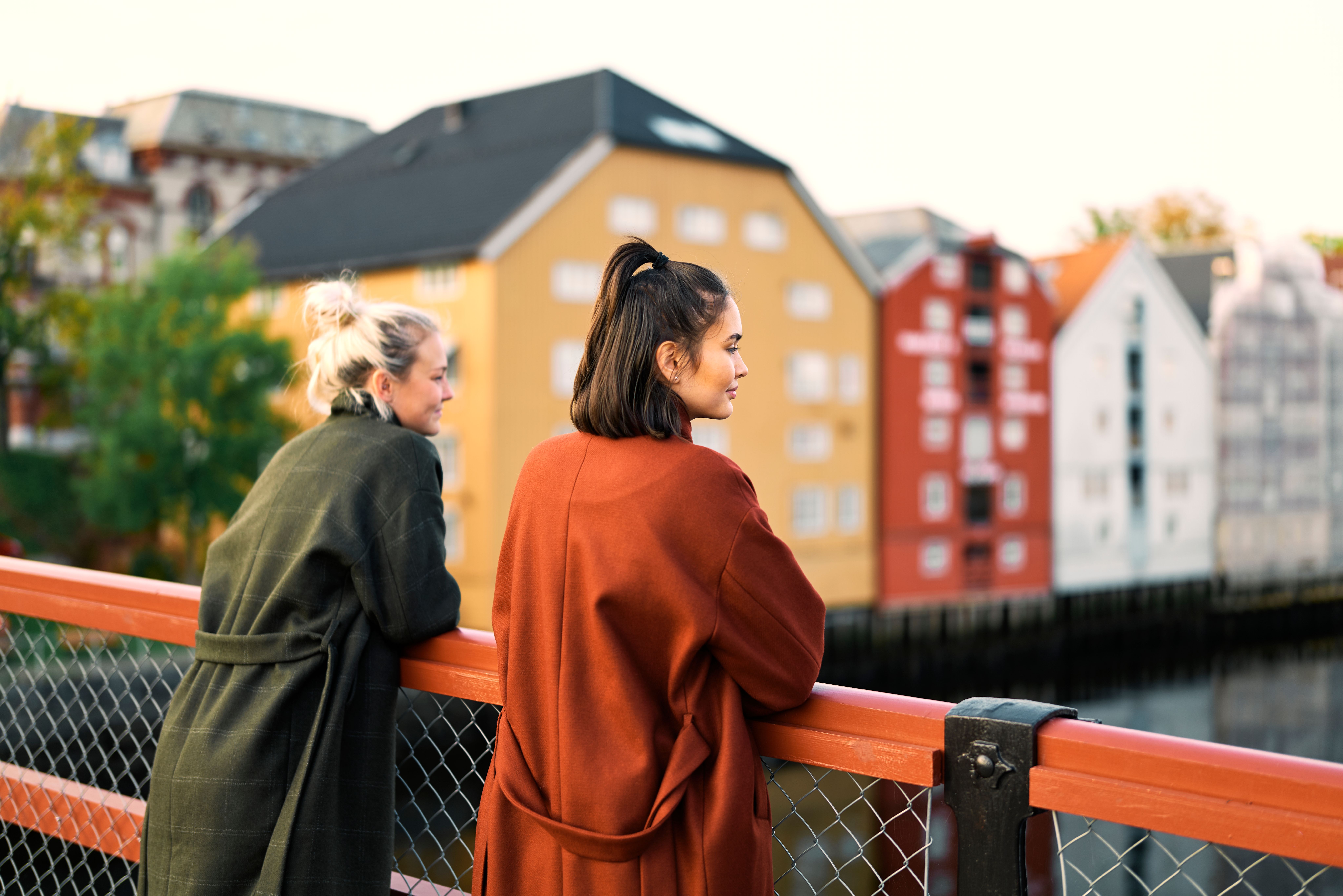 Two women are enjoying the view from the Gamle bybro bridge in Trondheim