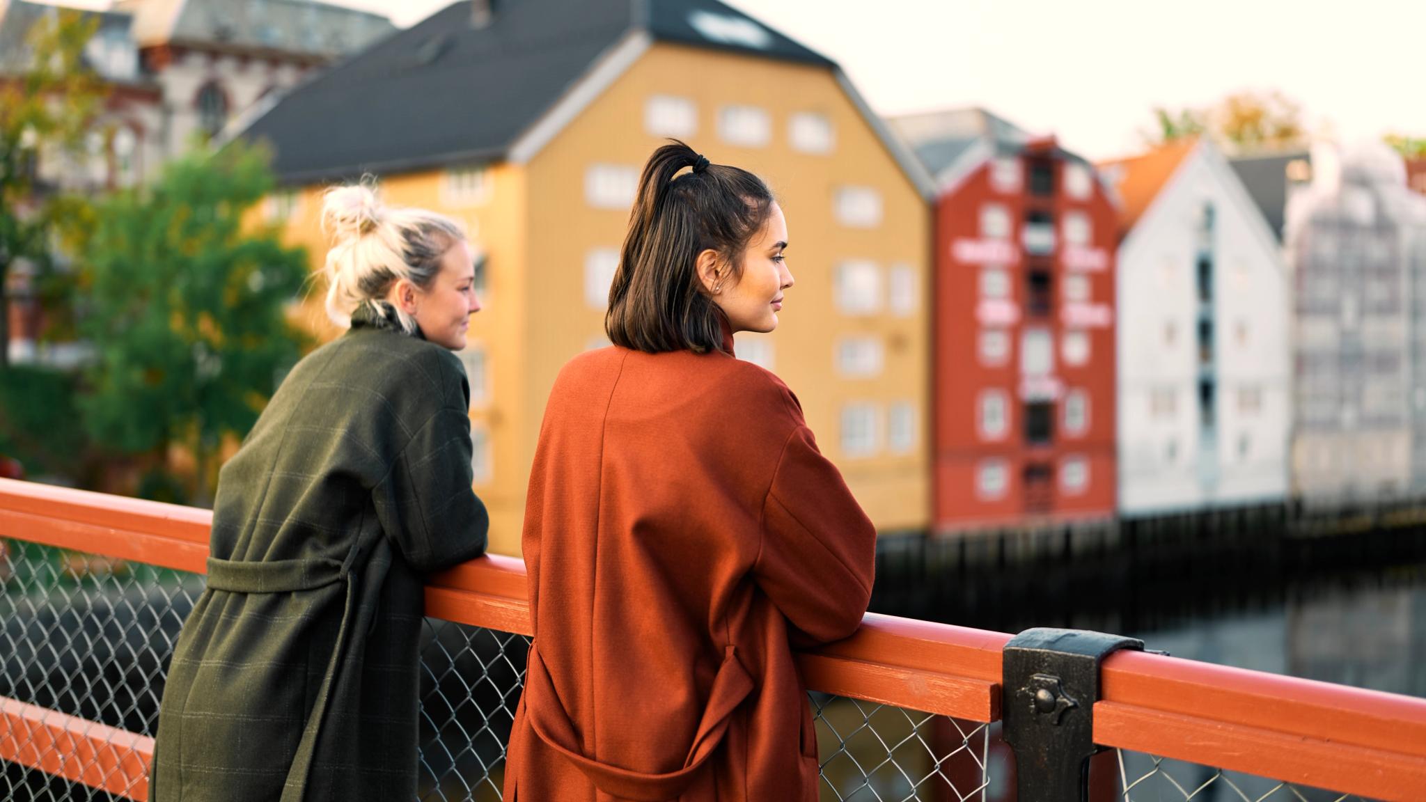 Two women are enjoying the view from the Gamle bybro bridge in Trondheim