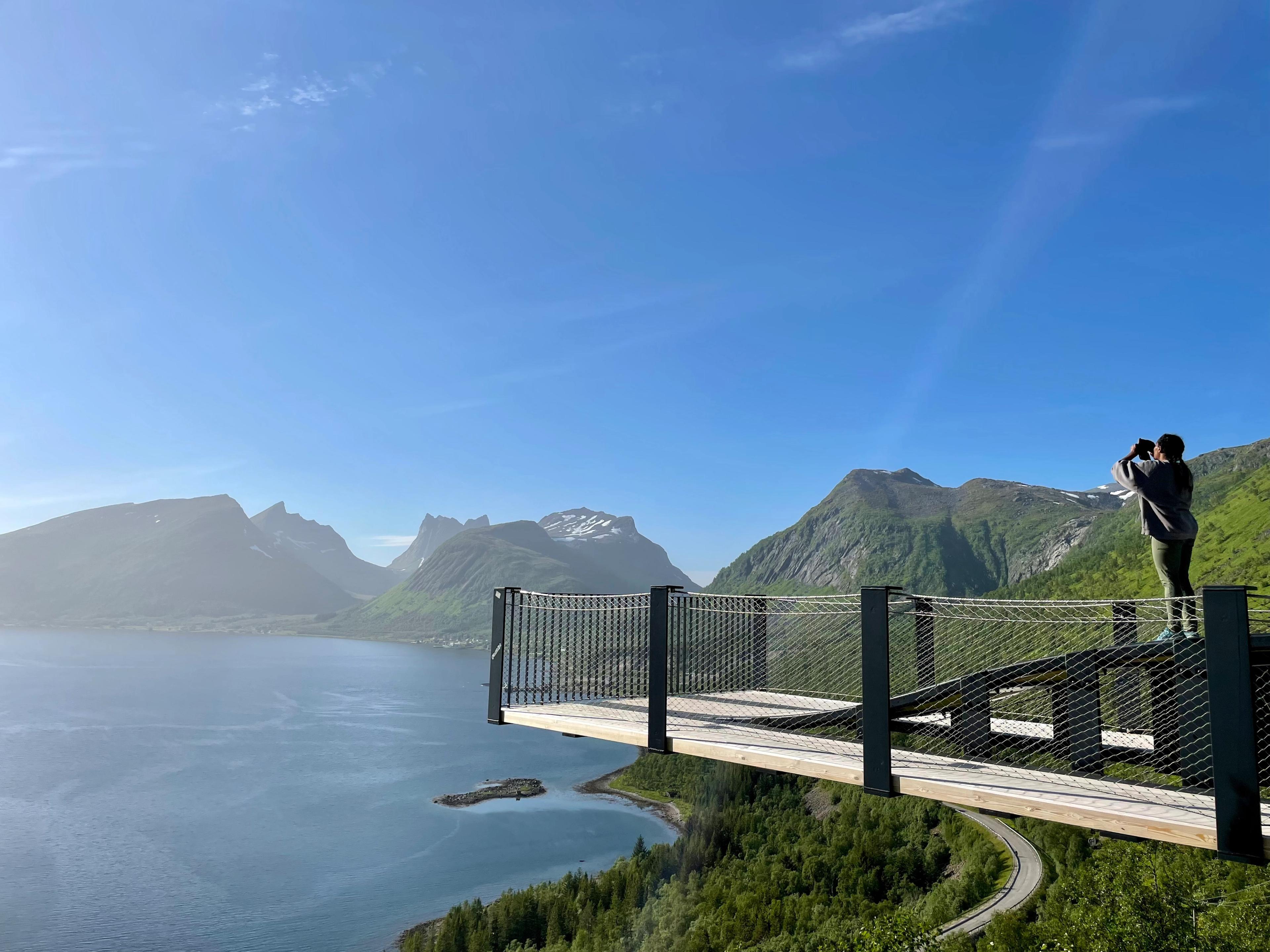 A woman standing at Bergsbotn viewing point