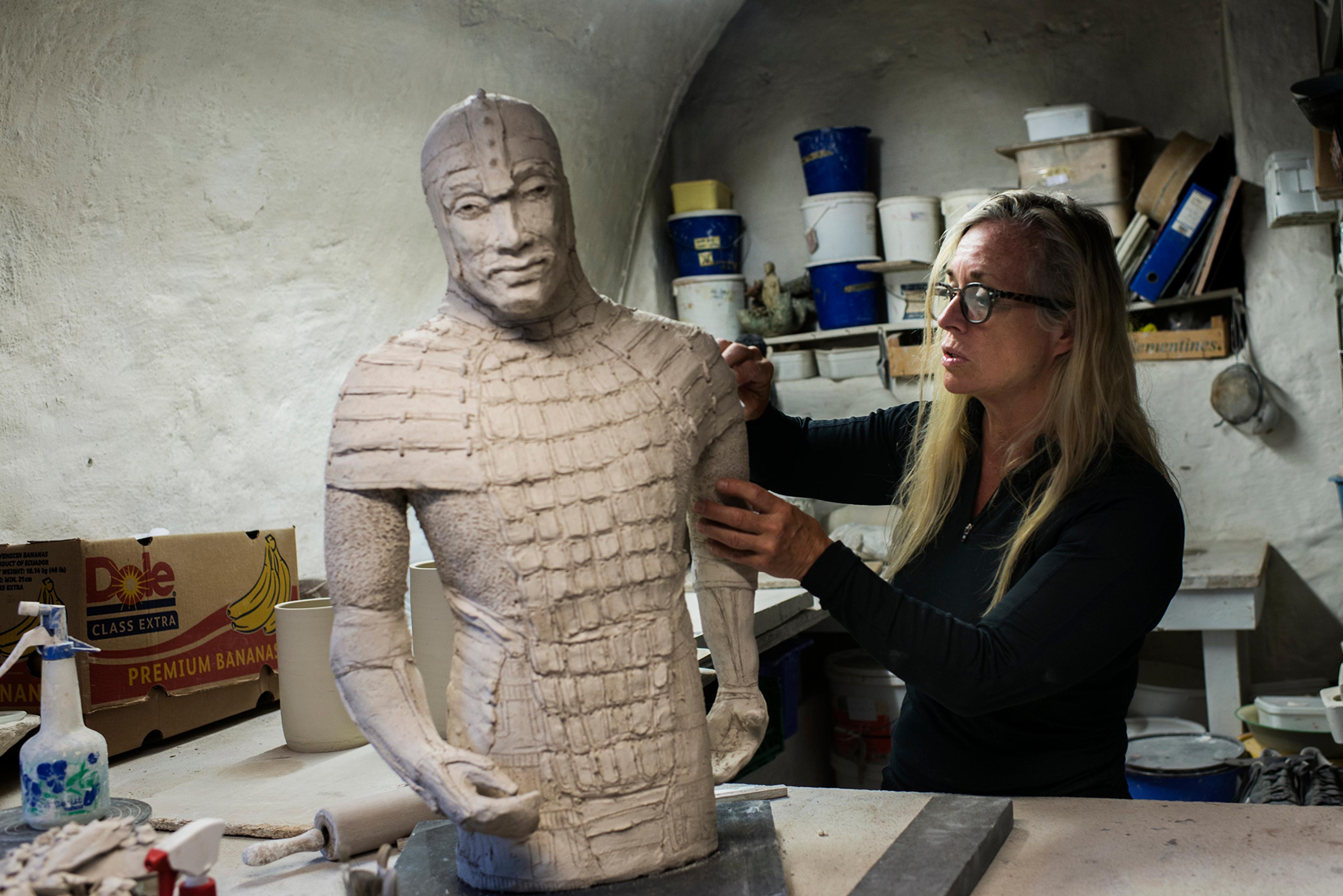 A sculptor in a workshop in Bryggen in Bergen, Fjord Norway