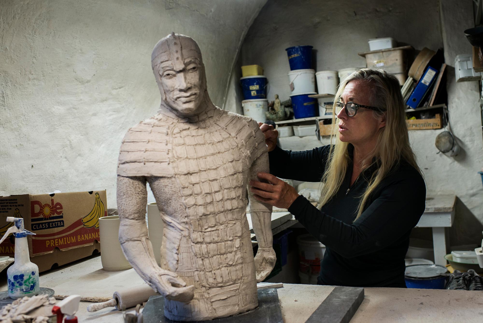 A sculptor in a workshop in Bryggen in Bergen, Fjord Norway