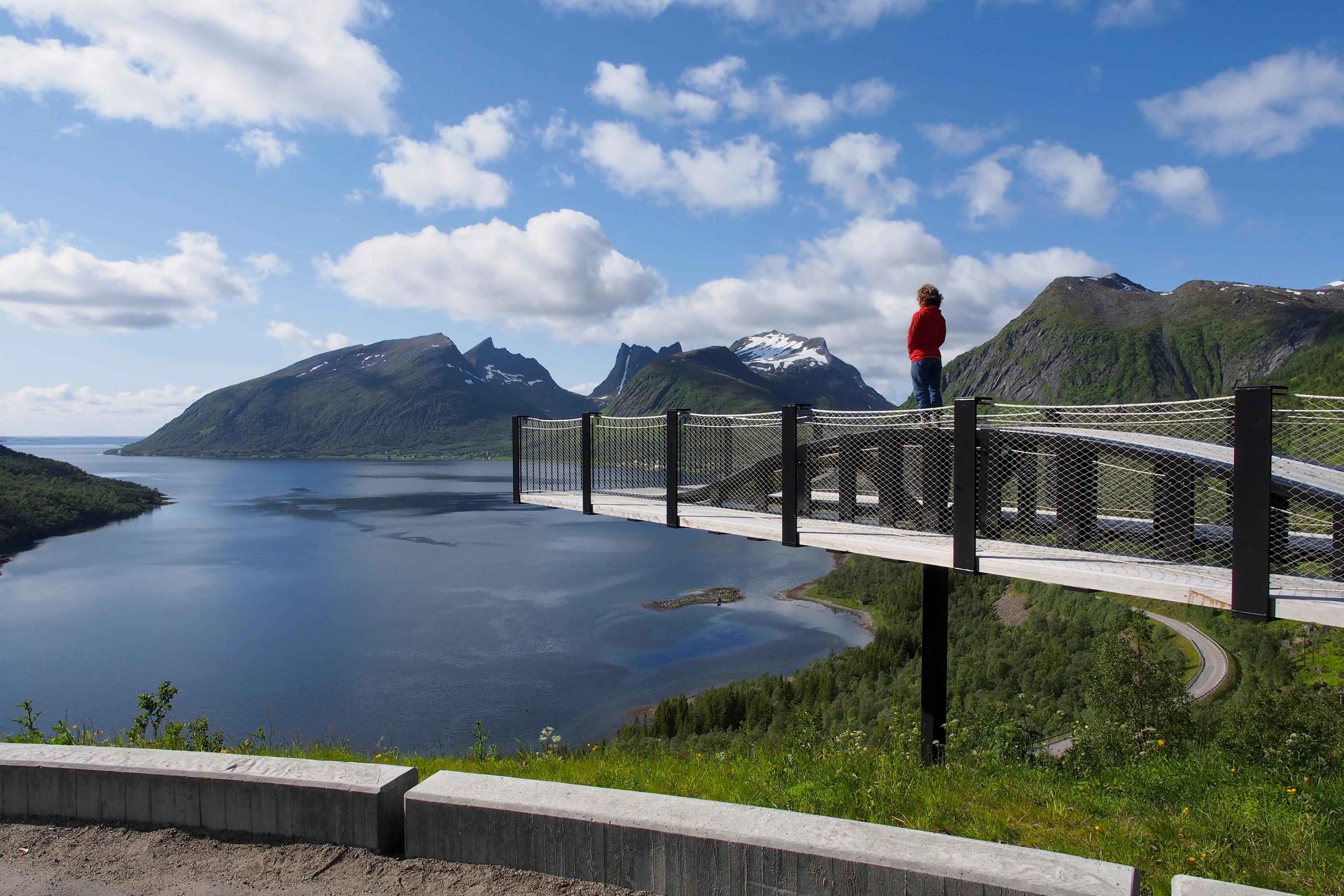 A person standing at the viewing platform in Bergsbotn on the Norwegian Scenic Route Senja, Northern Norway