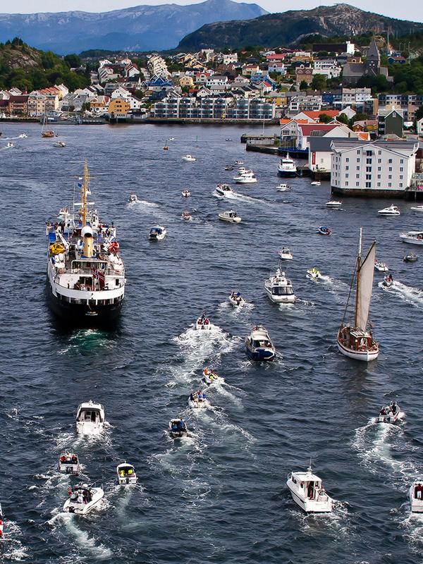 A myriad of large and small boats travelling towards Kristiansund in the Northwest, Fjord Norway