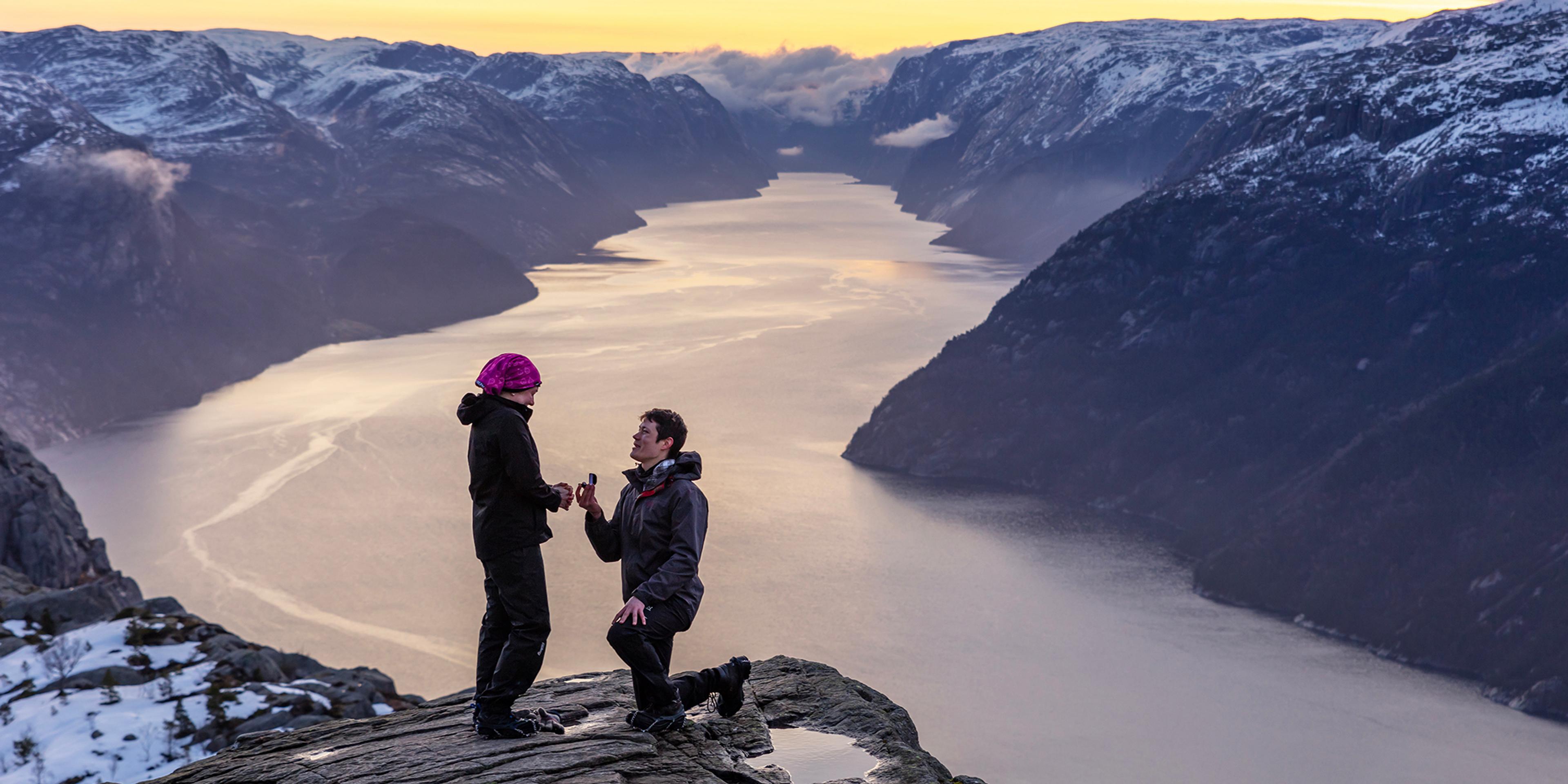 Man proposing to woman at Preikestolen mountain