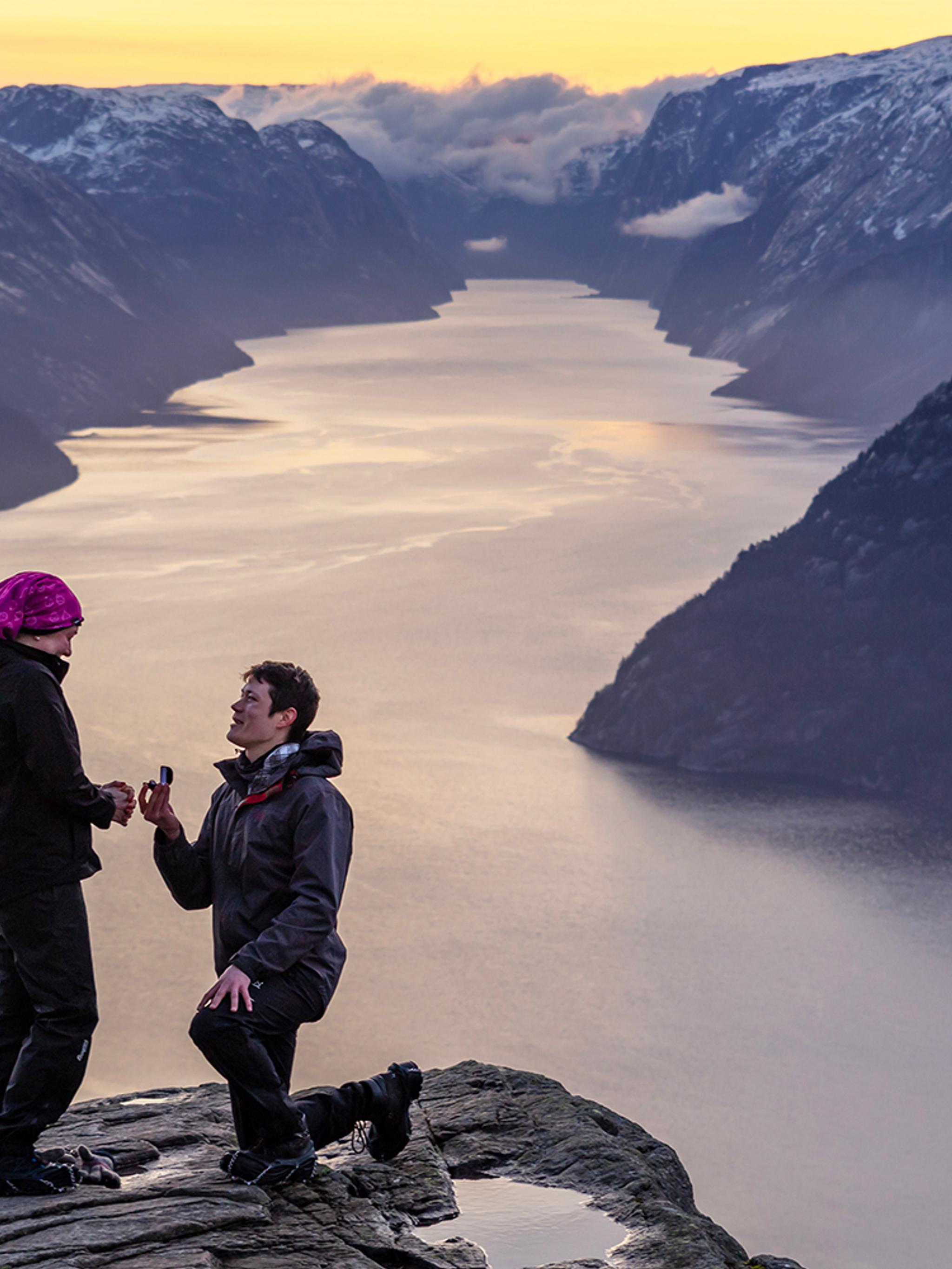 Man proposing to woman at Preikestolen mountain