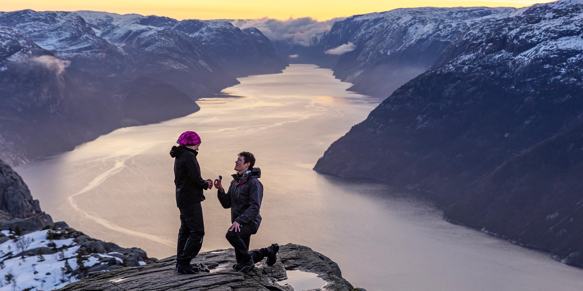Man proposing to woman at Preikestolen mountain