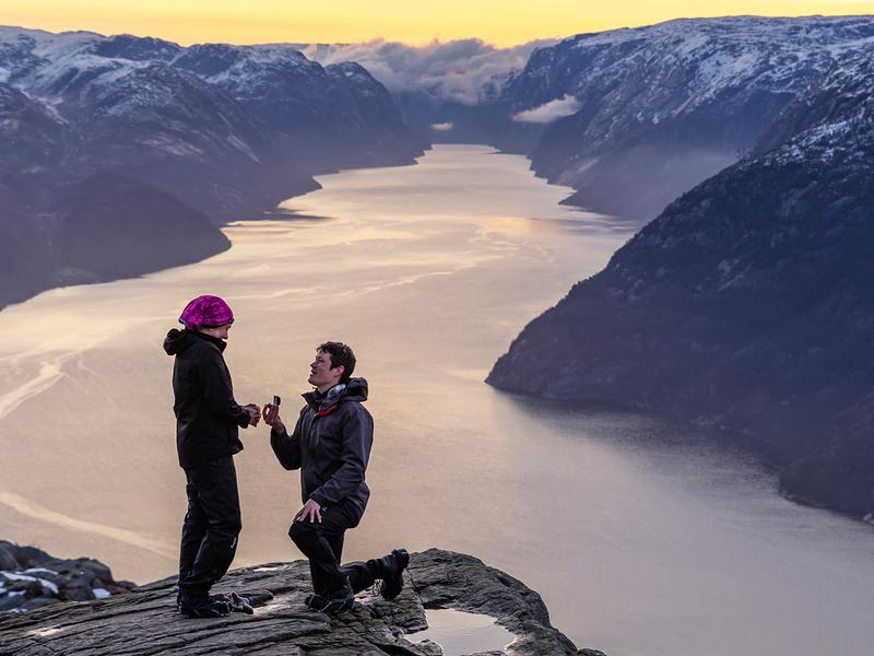 Man proposing to woman at Preikestolen mountain